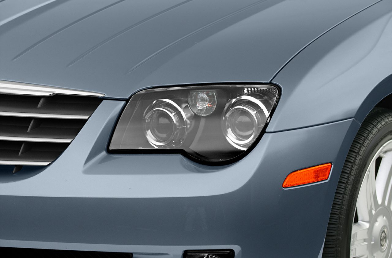 Close-up of front headlight and grille with side marker light