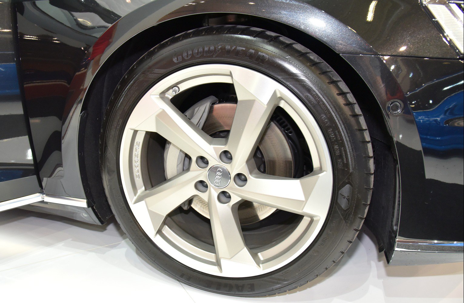 Close-up of alloy rim and tire with disc brake