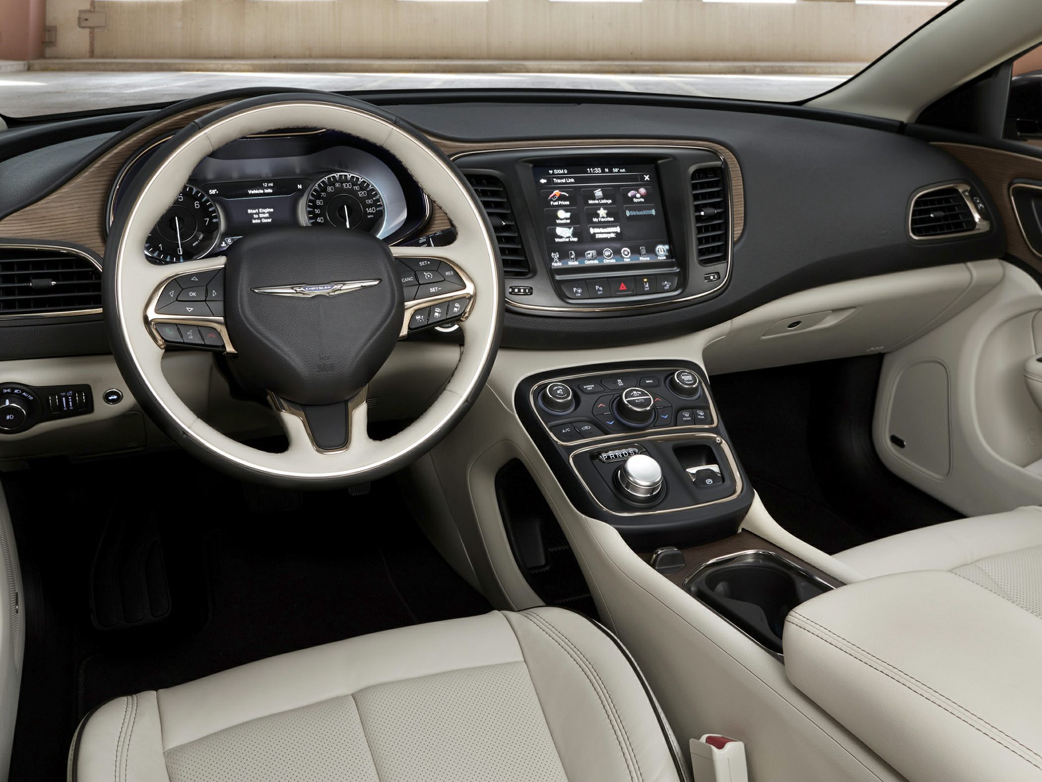 Interior dashboard and steering wheel with controls and infotainment screen