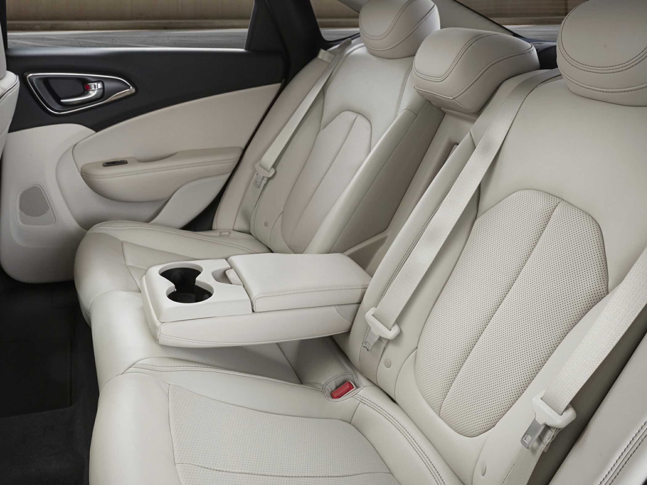 Beige leather rear seats with center armrest and cup holders