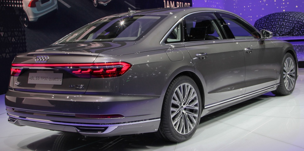 Luxury sedan rear view with LED tail lights and sleek design