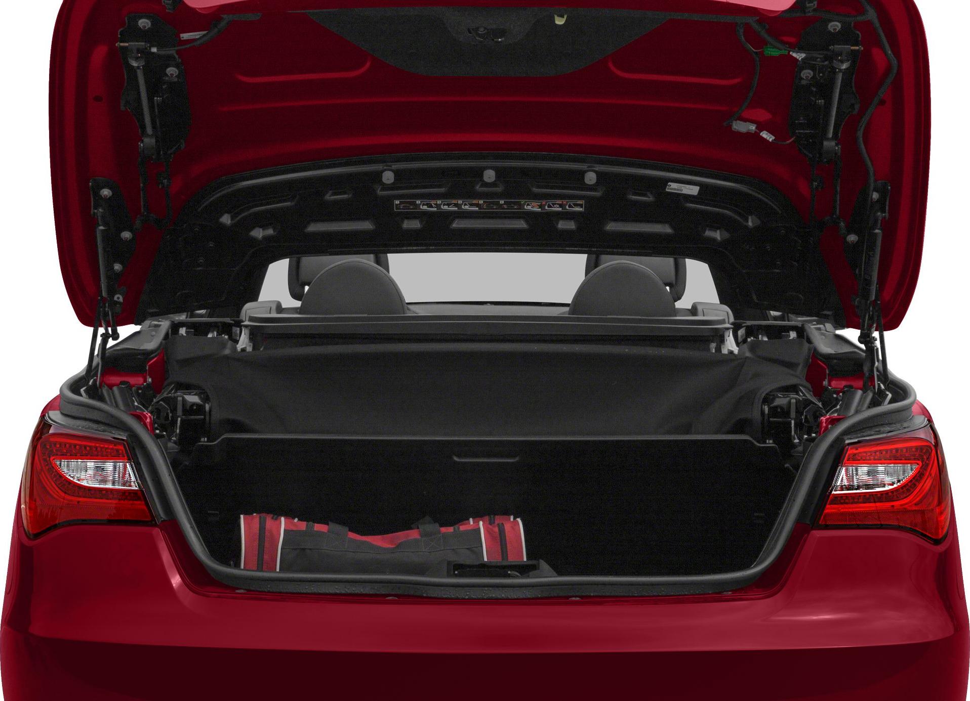Open trunk with convertible roof mechanism and folded soft top
