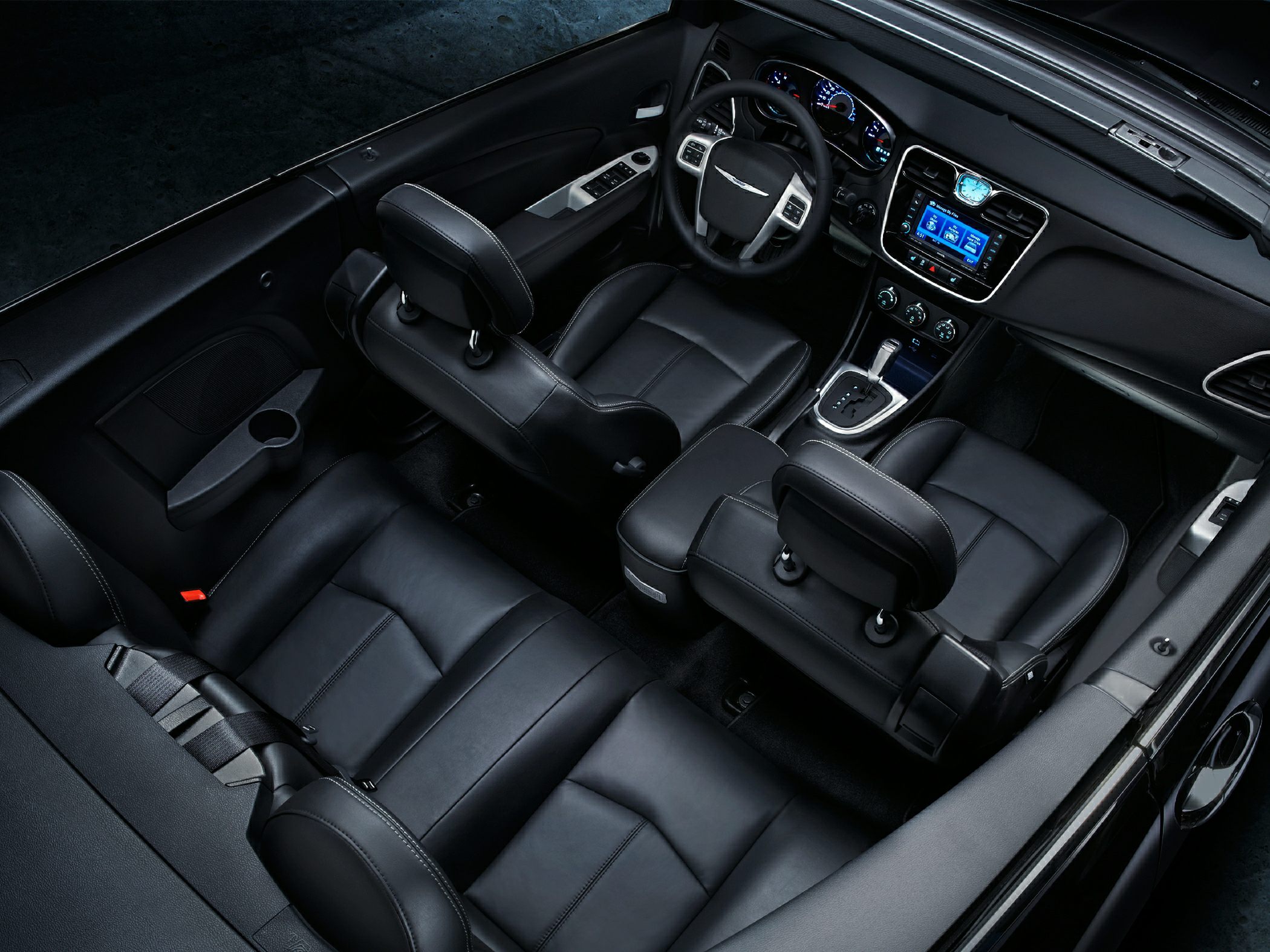 Black leather seats and modern dashboard in a convertible interior
