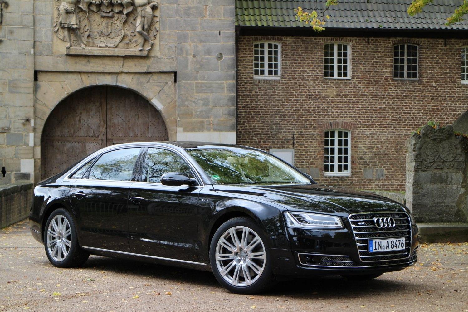Black luxury sedan with LED matrix headlights and W12 engine badge