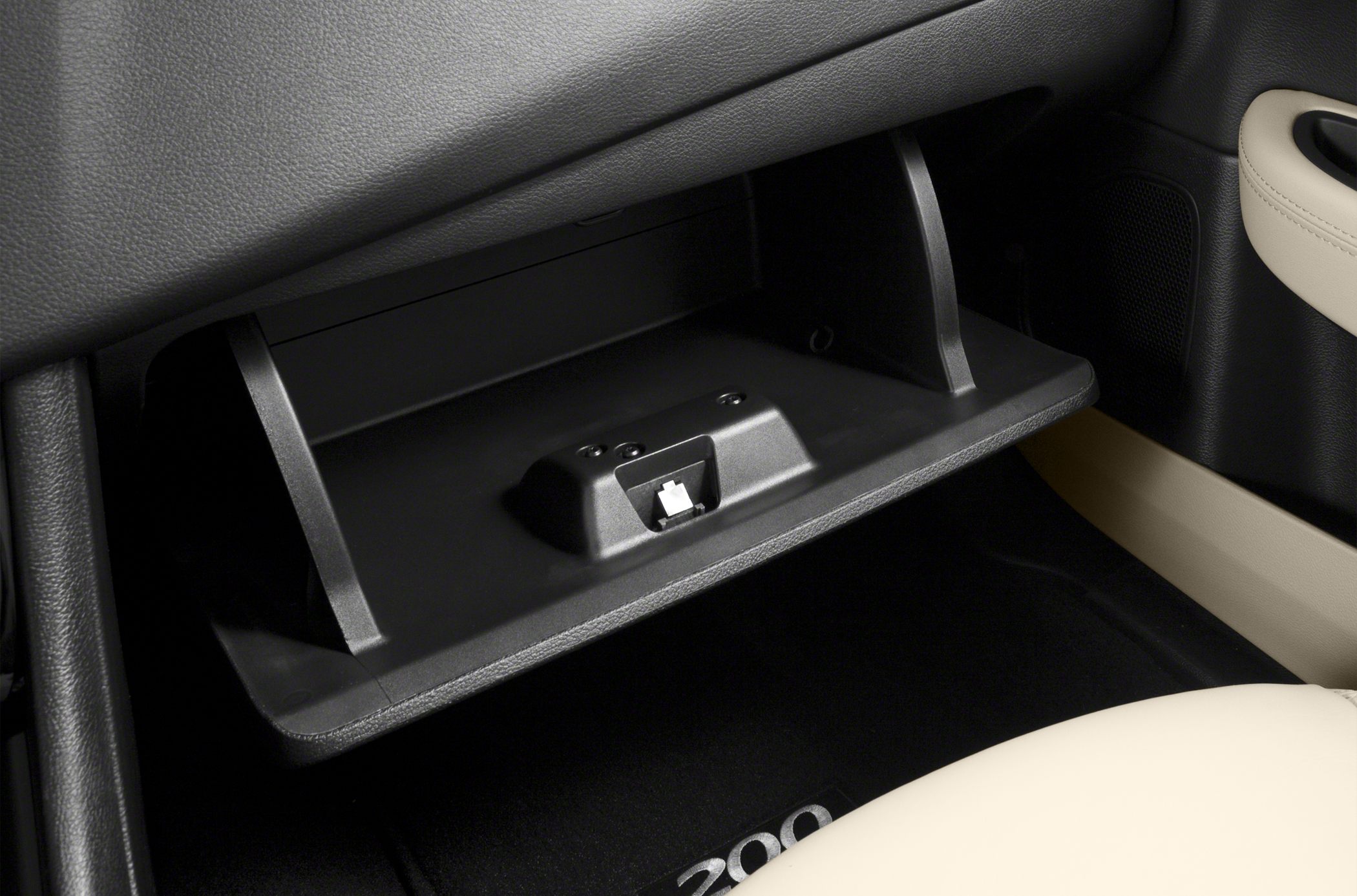 Open glove compartment with latch mechanism inside car interior