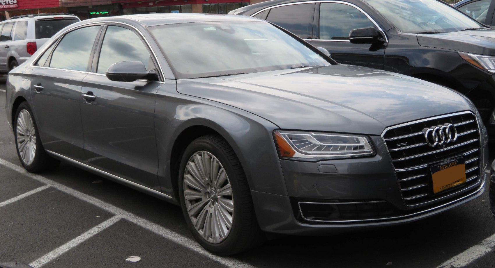 Front side view with LED headlights and multi-spoke alloy wheels