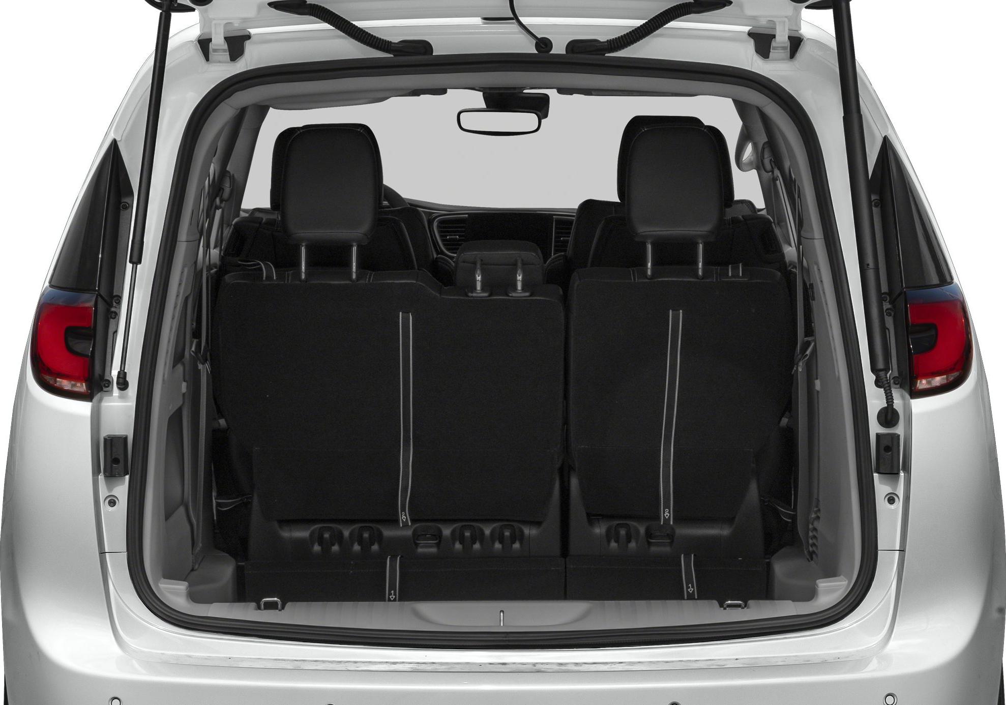 Rear trunk with upright back seats and visible headrests.