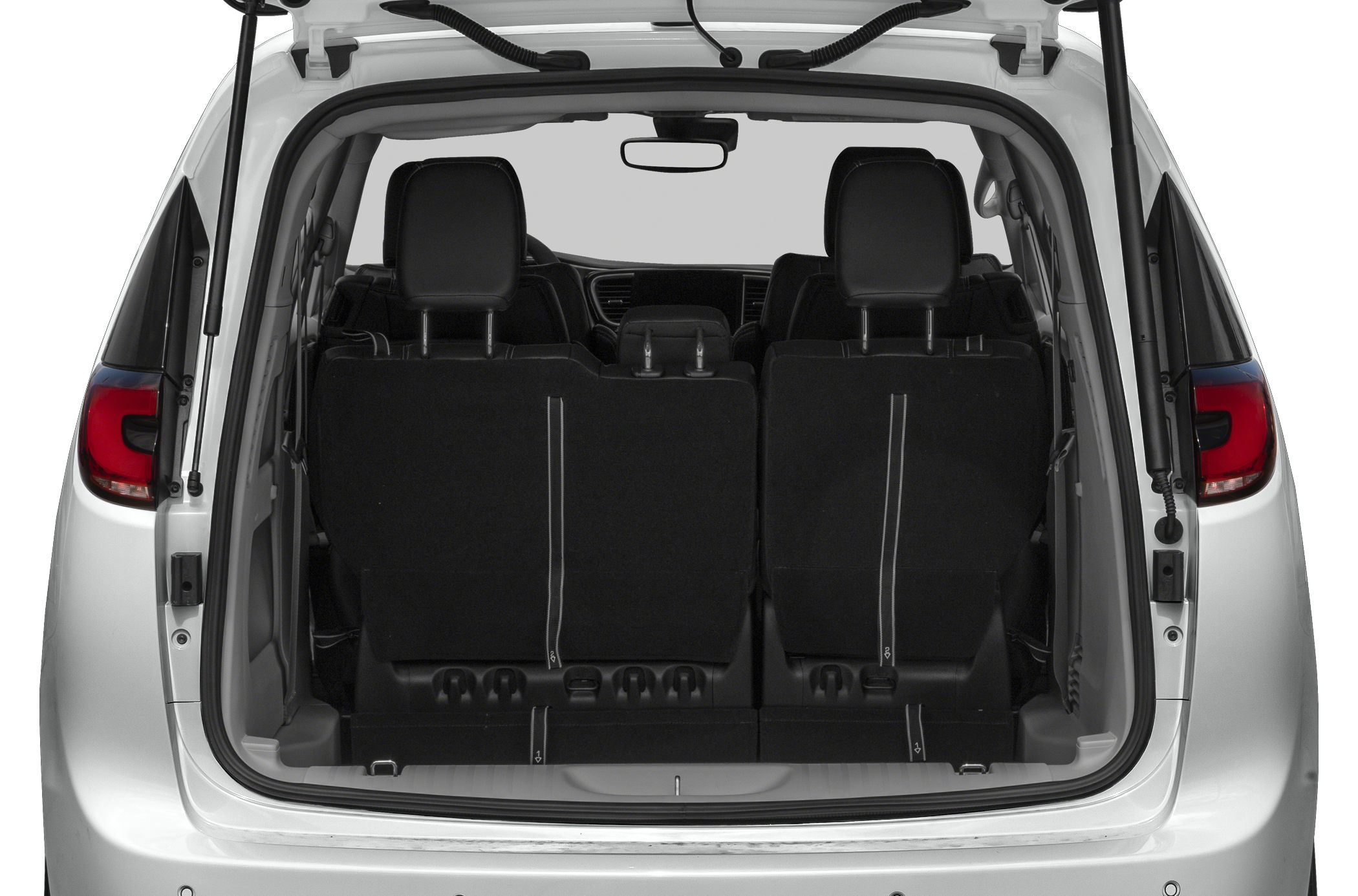 Rear interior with folded seats and visible headrests