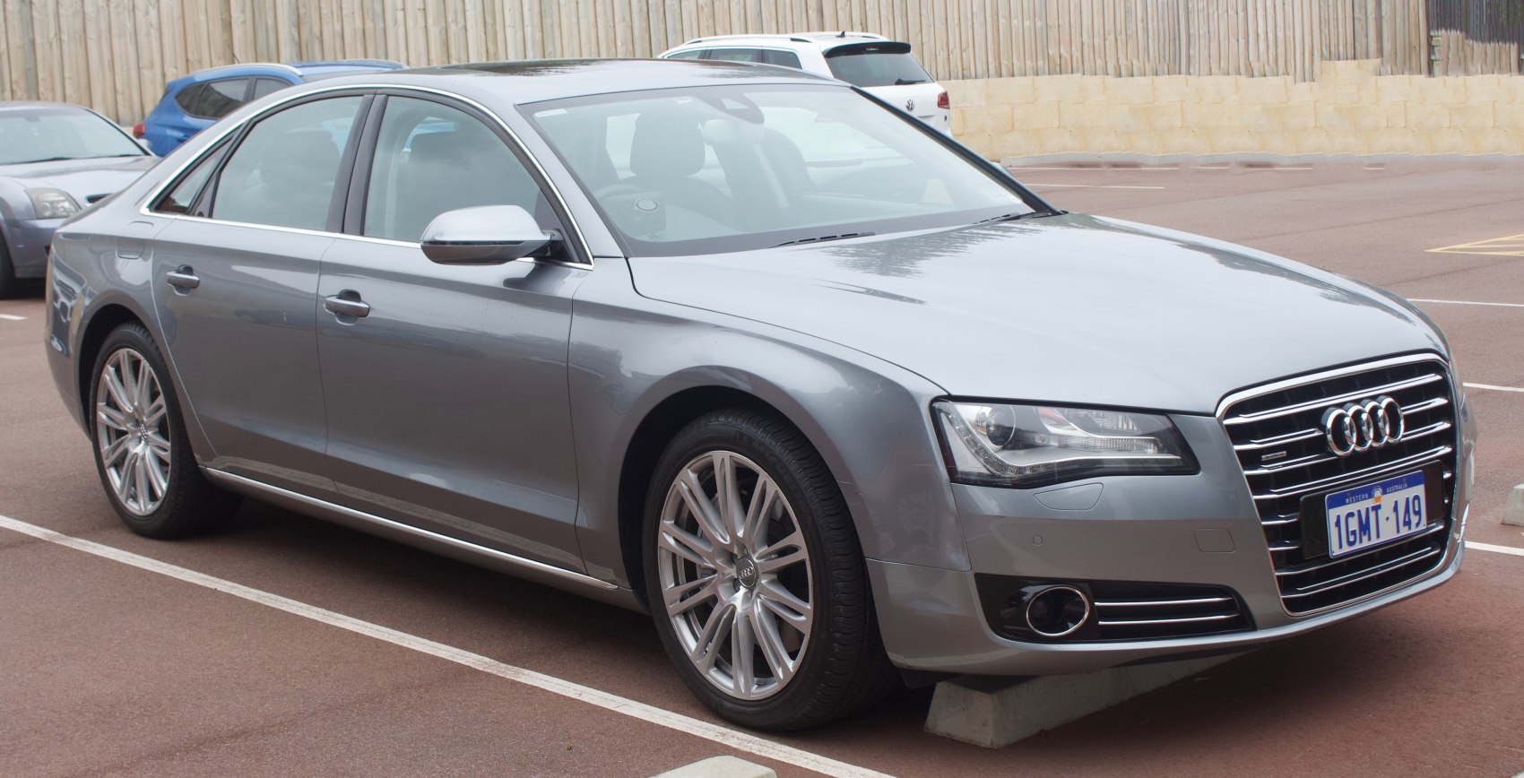 Front side view of a sleek silver luxury sedan with distinctive grille and alloy wheels