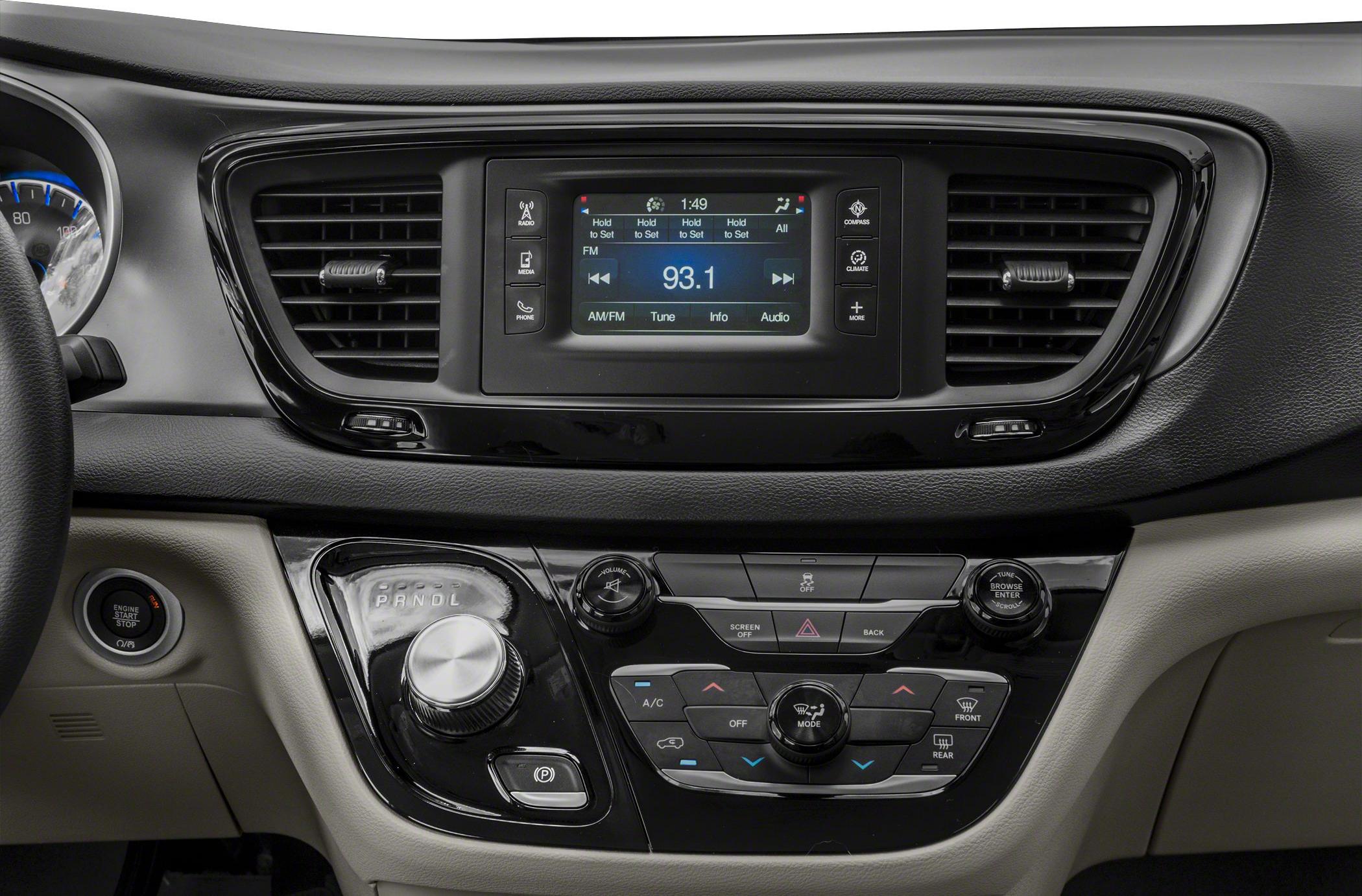 Dashboard center console with infotainment screen and rotary gear selector