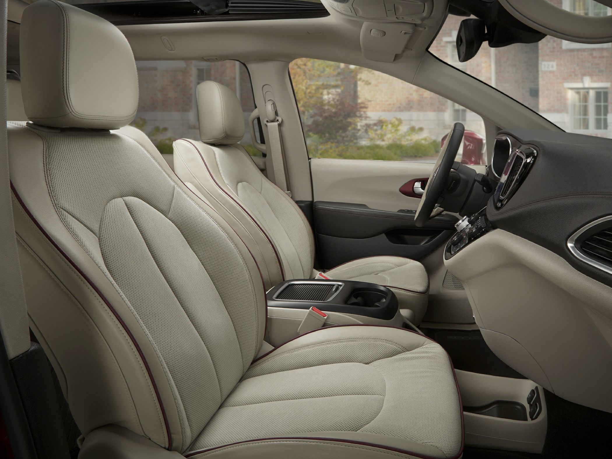 Beige leather front seats and spacious cabin interior