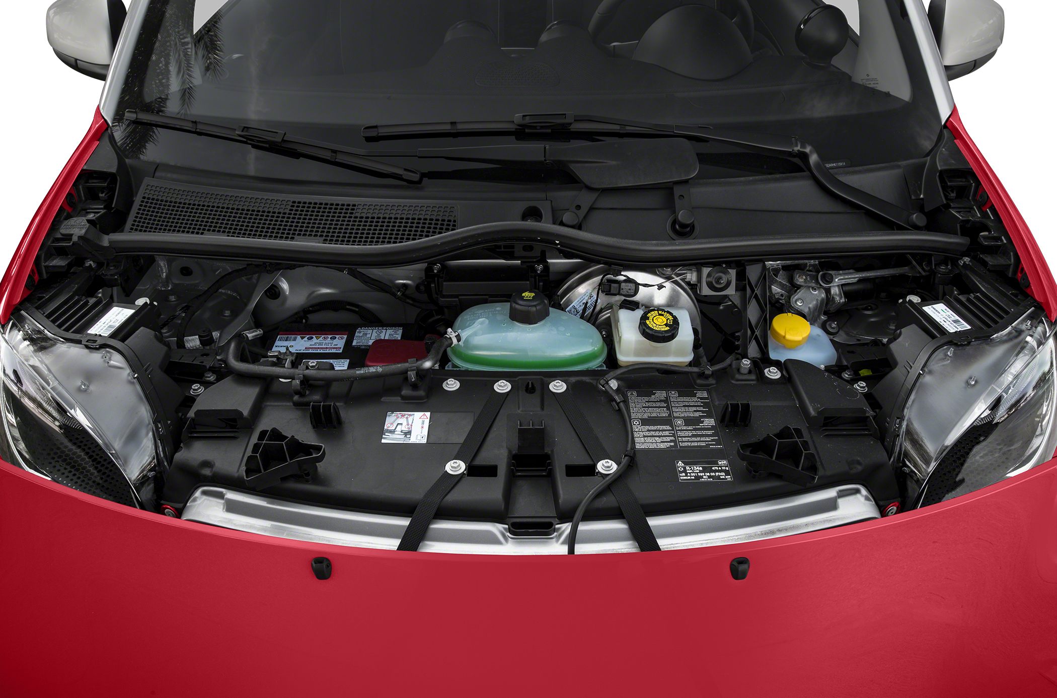 Close-up of engine compartment with visible fluid reservoirs and car hood edges