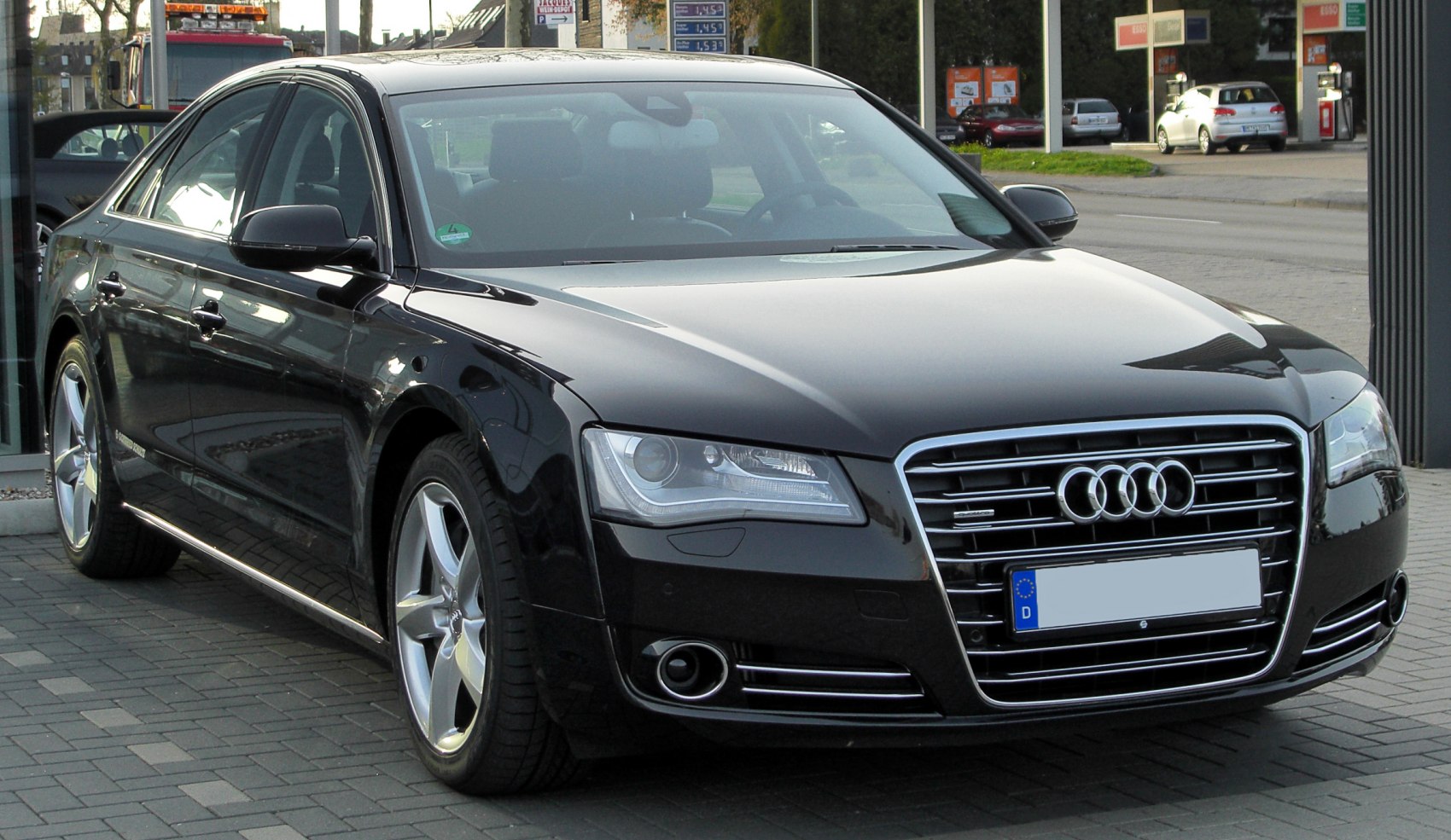 Front view of luxury sedan with LED headlights and chrome grille