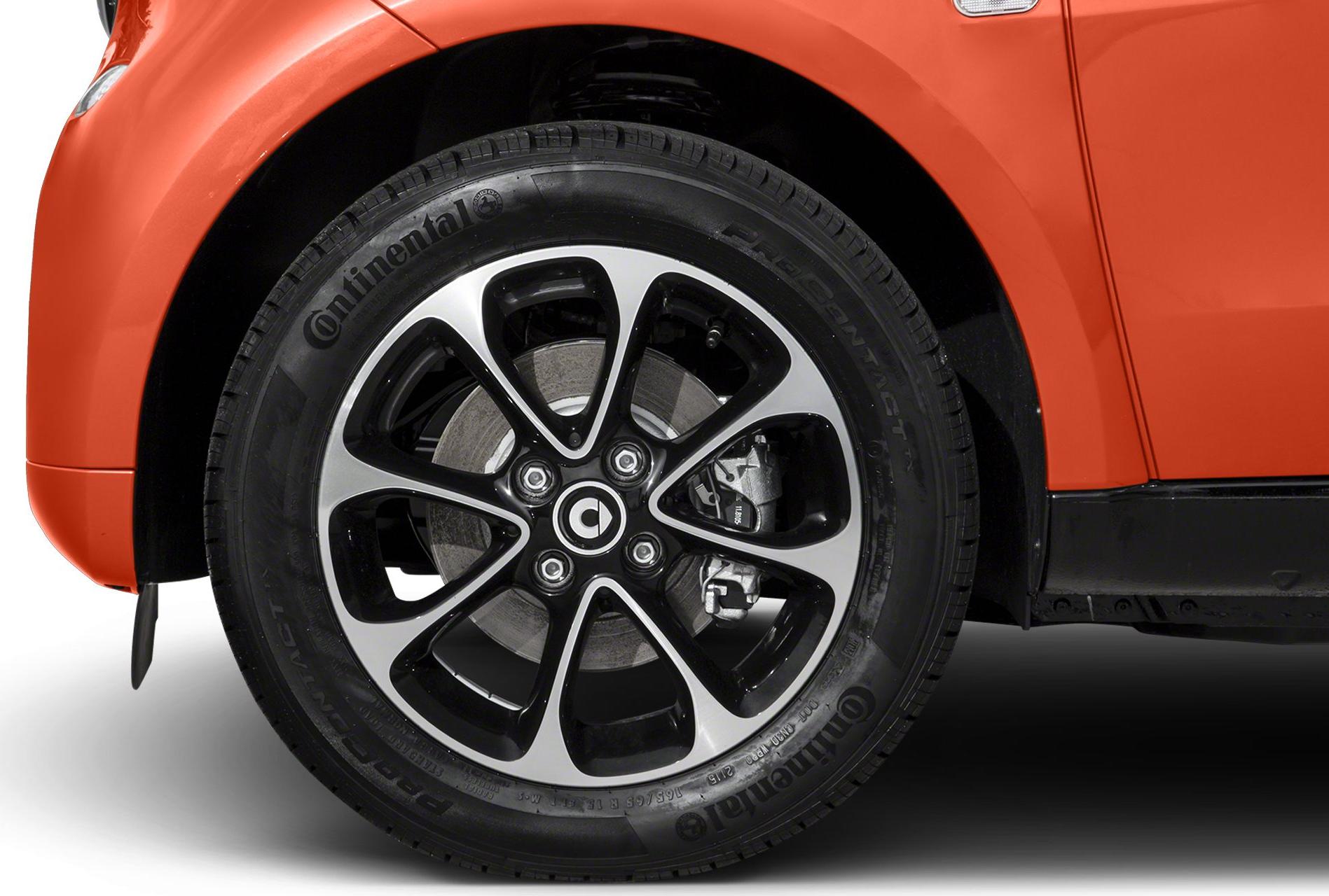 Alloy wheel and tire close-up with brake disc and caliper