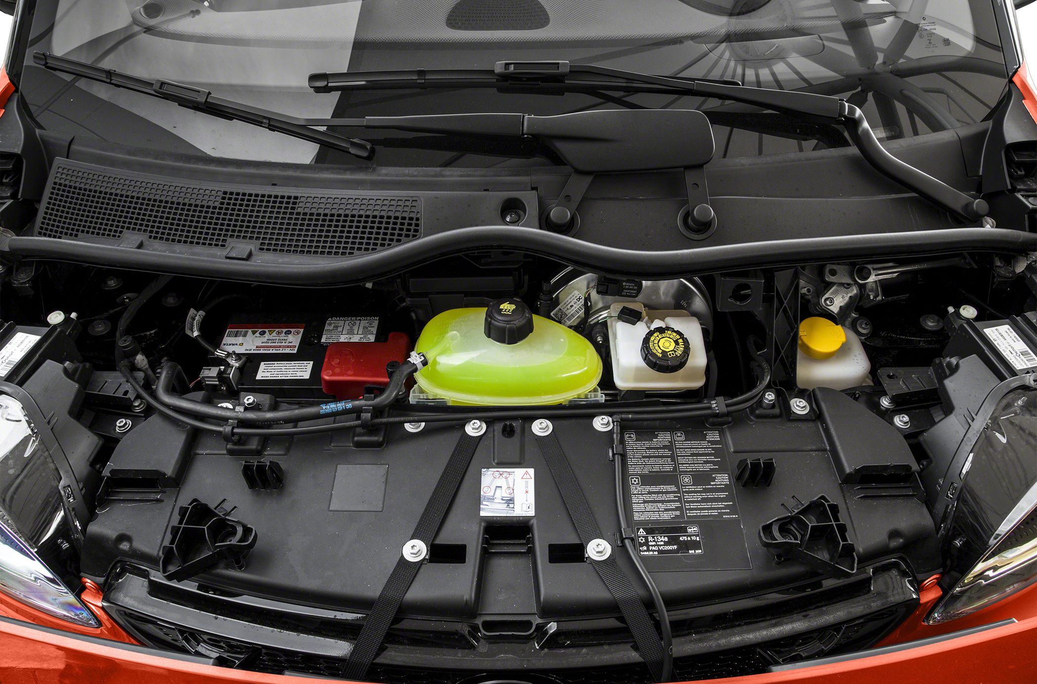 Engine bay with fluid reservoirs and battery compartment
