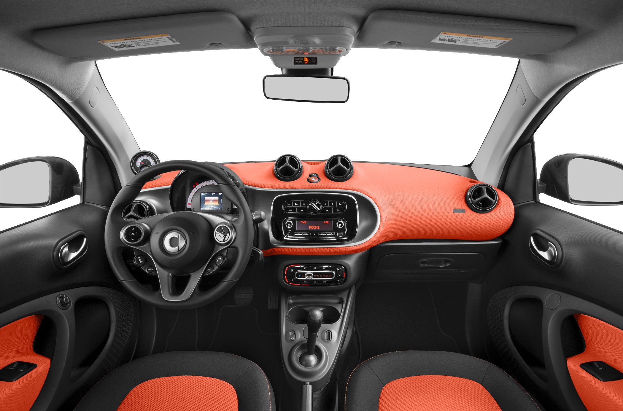 Dashboard with circular air vents and two-tone seating upholstery