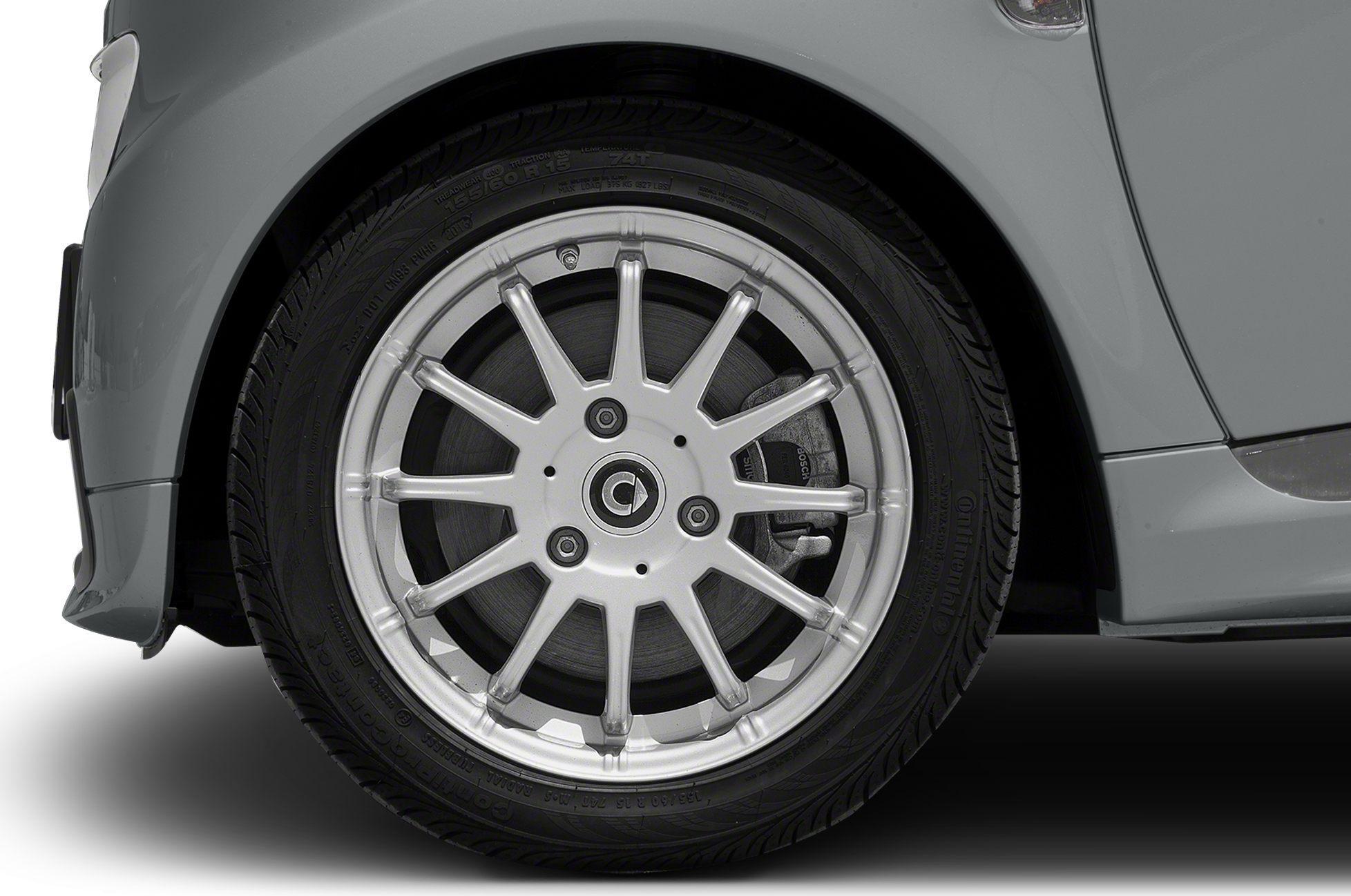 Alloy multi-spoke wheel and tire close-up with visible brake components