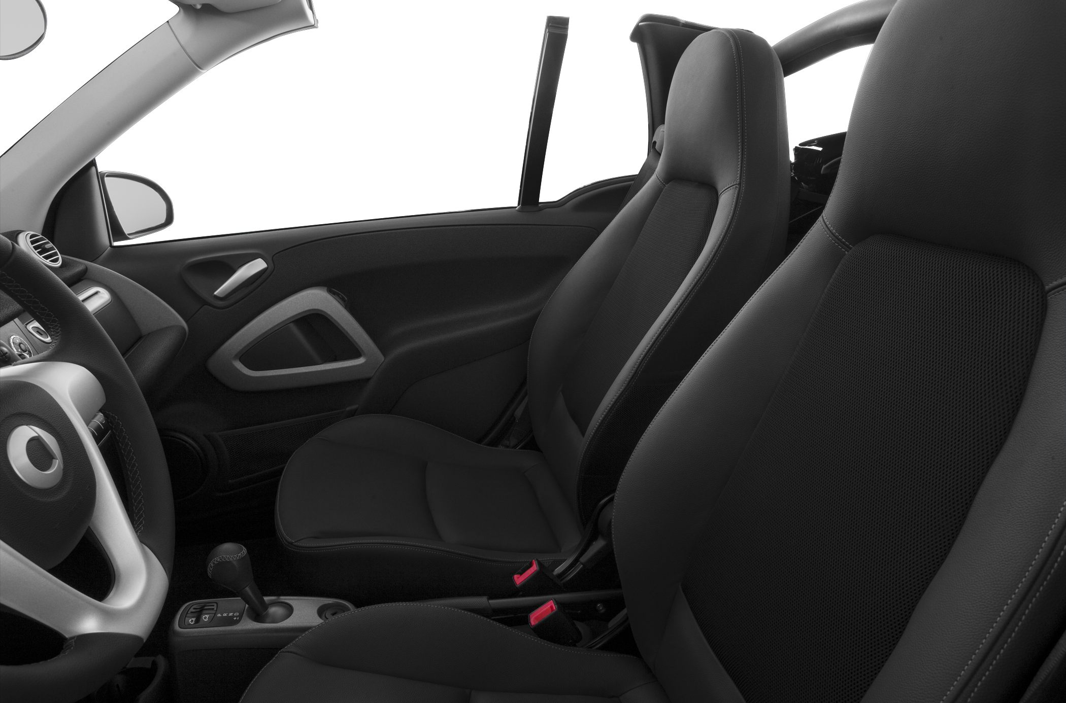 Black interior seats and dashboard detail with automatic gear lever
