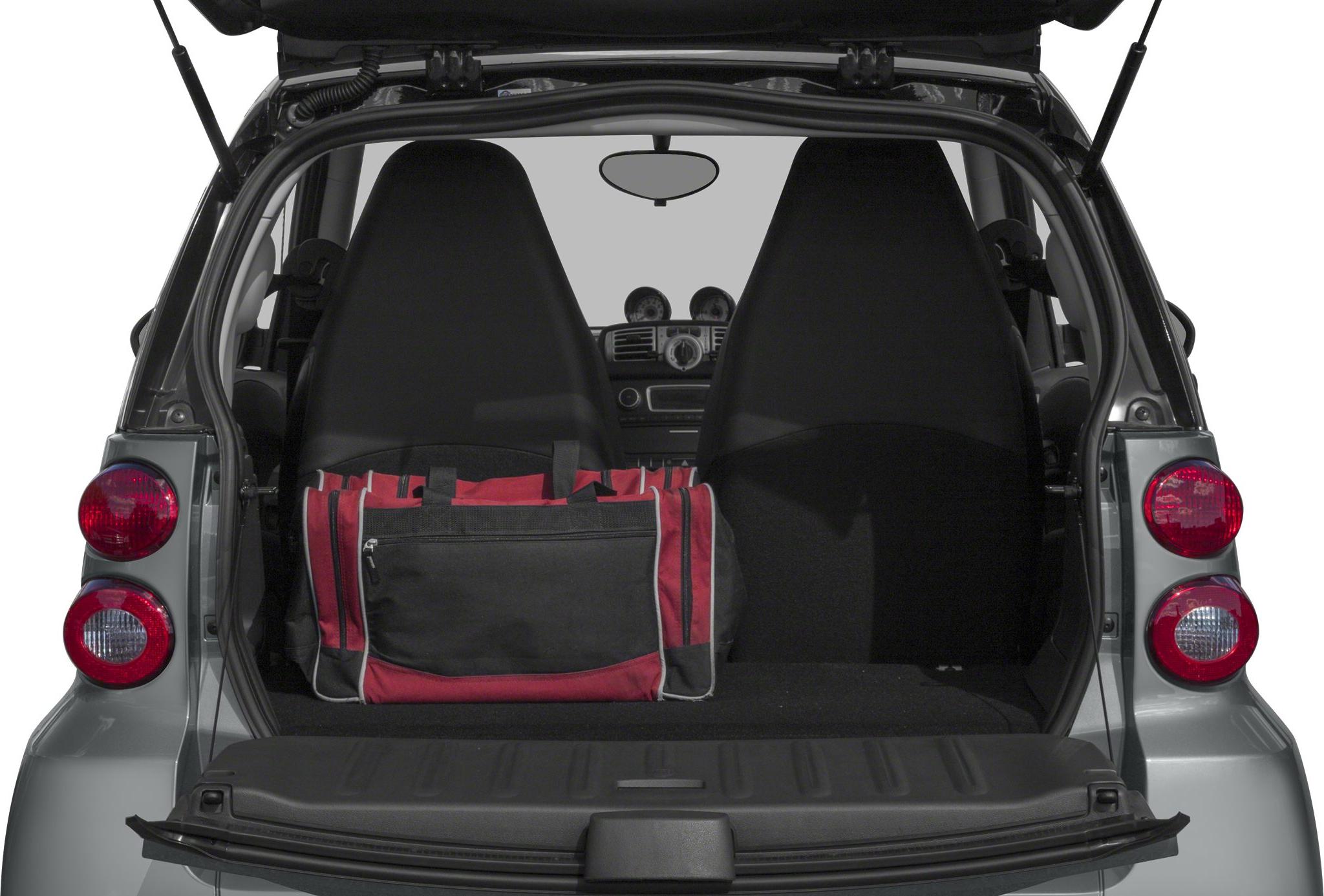 Open rear hatch showing compact cargo space and two seats inside