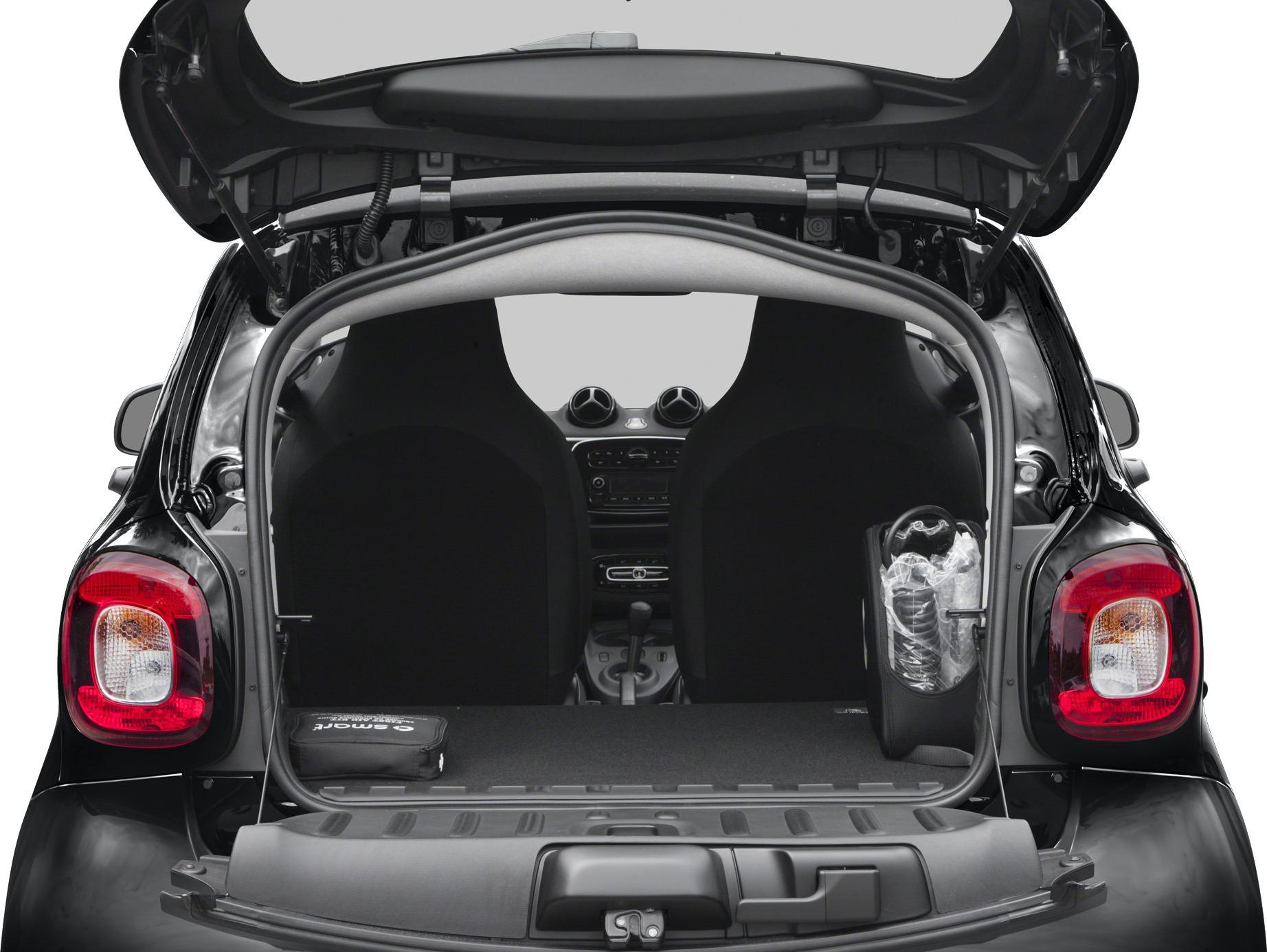 Compact rear trunk with two front seats visible