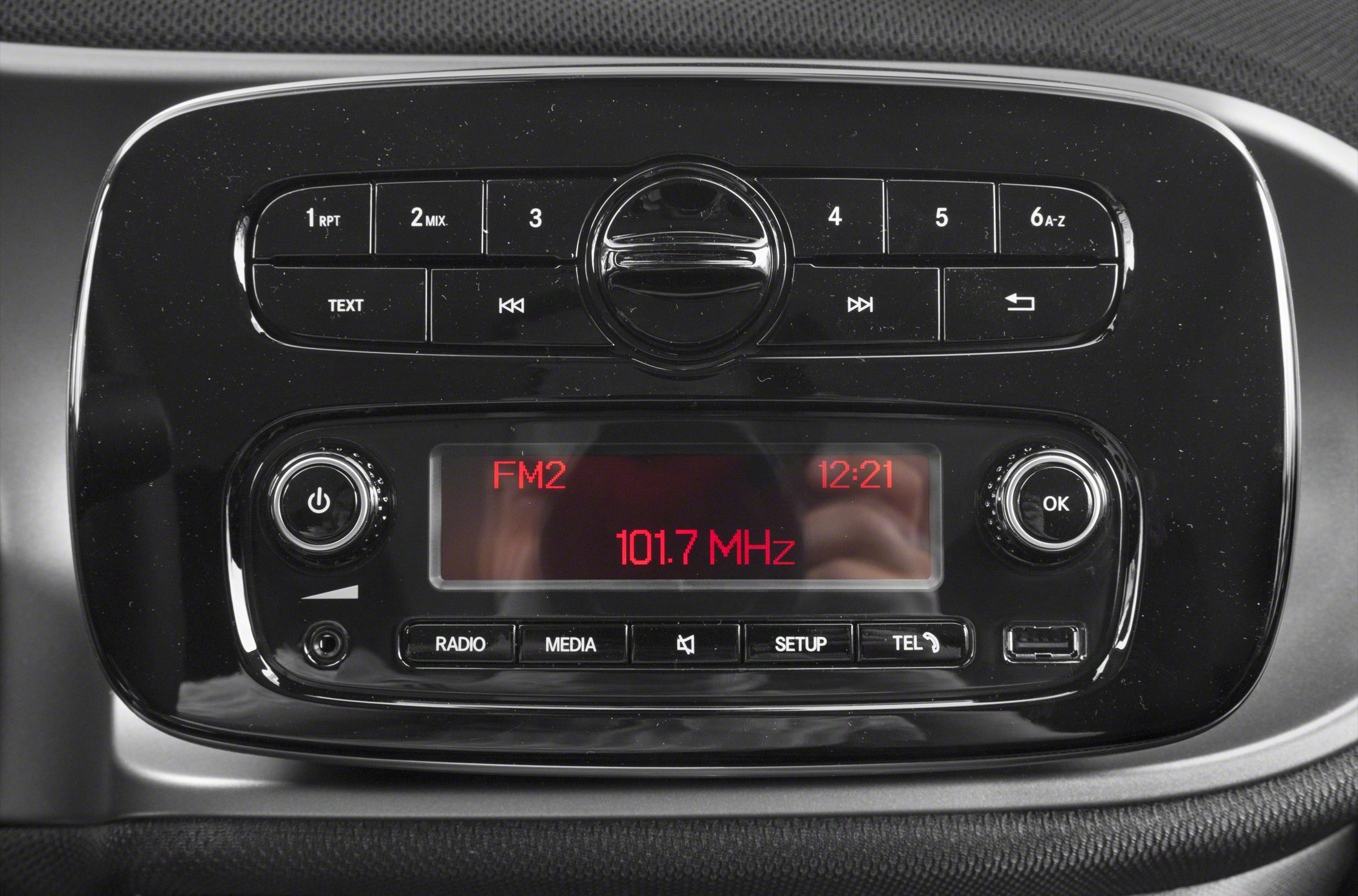 Car audio control panel with radio display and media buttons