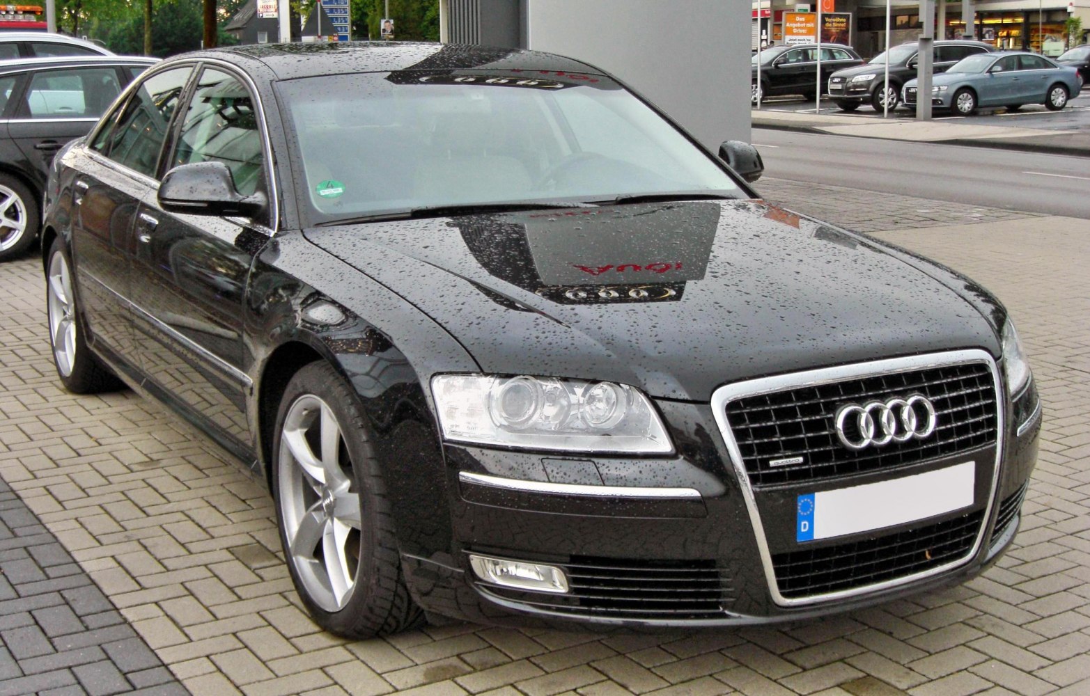 Front exterior view with distinctive grille and headlights in luxury sedan.
