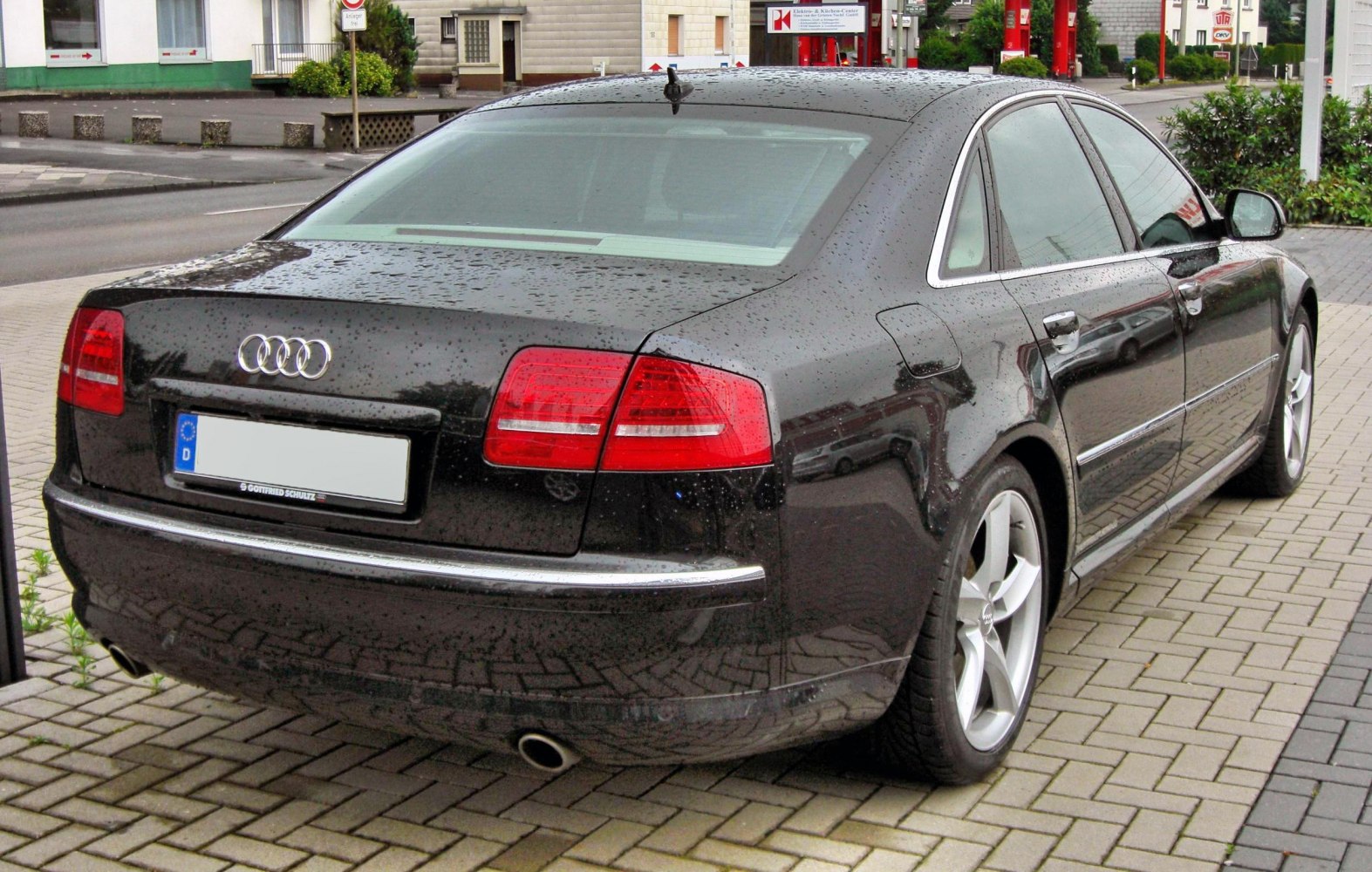 Rear view of luxury sedan with distinct taillights and dual exhaust