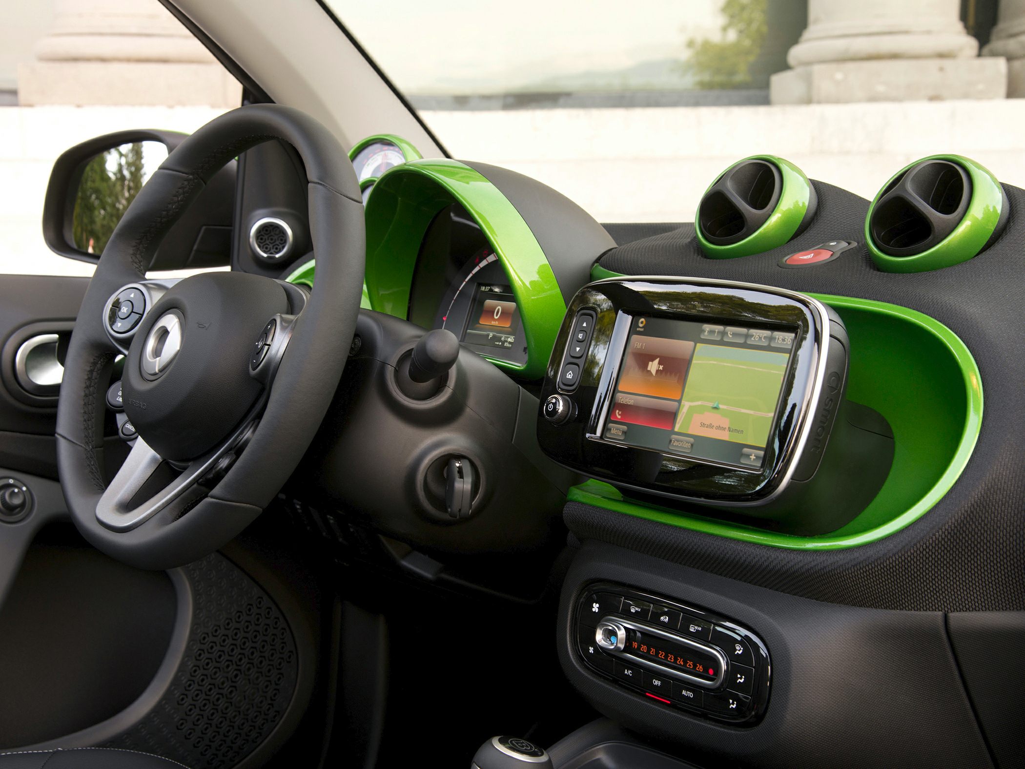 Dashboard with touchscreen and compact steering wheel