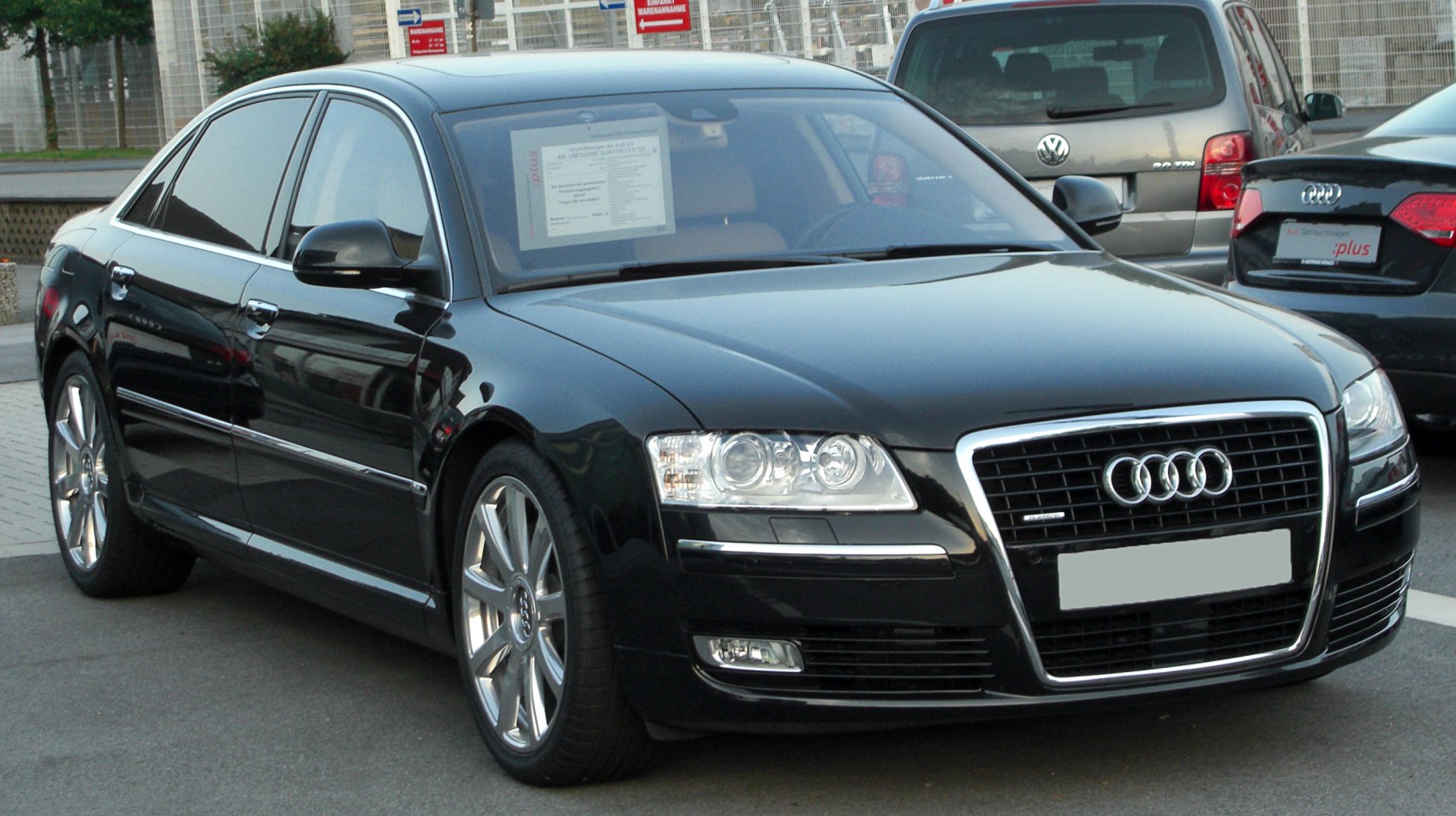 Luxury sedan front with prominent grille and headlights