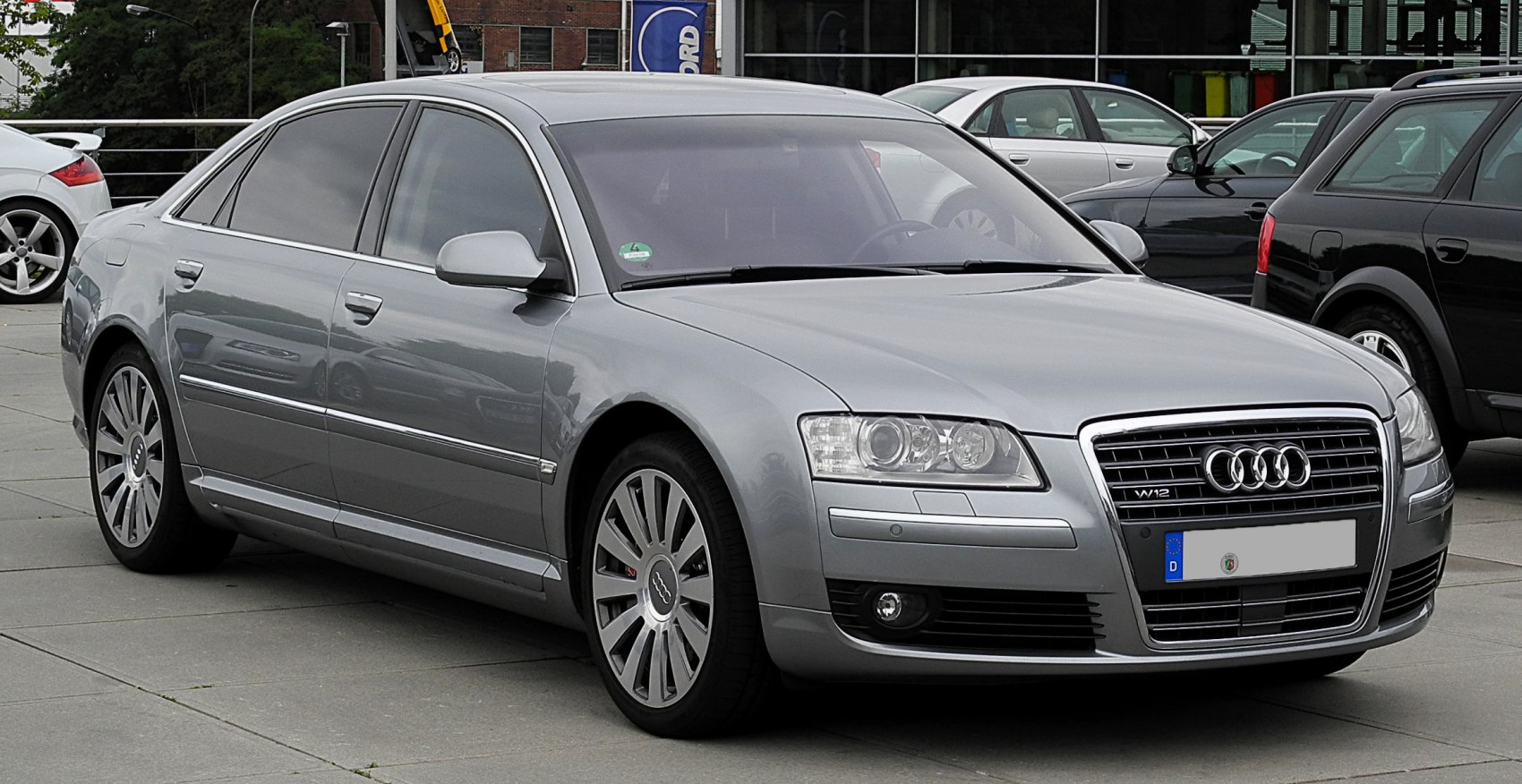 Luxury sedan with distinctive grille, alloy wheels, and tinted windows