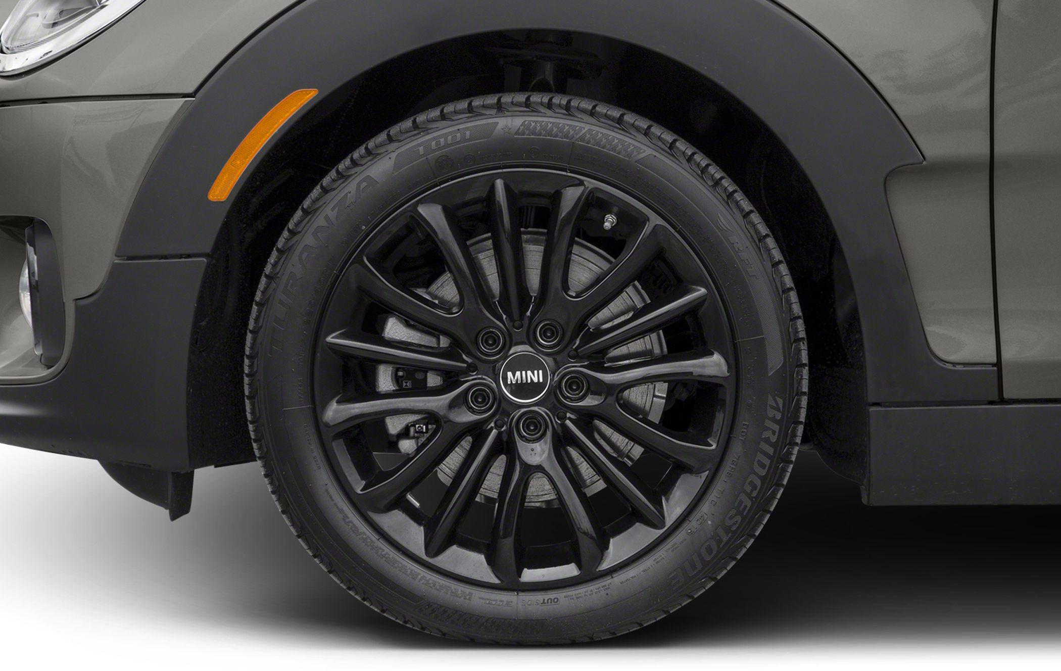 Black multi-spoke alloy wheel with Bridgestone tire and brake disc.