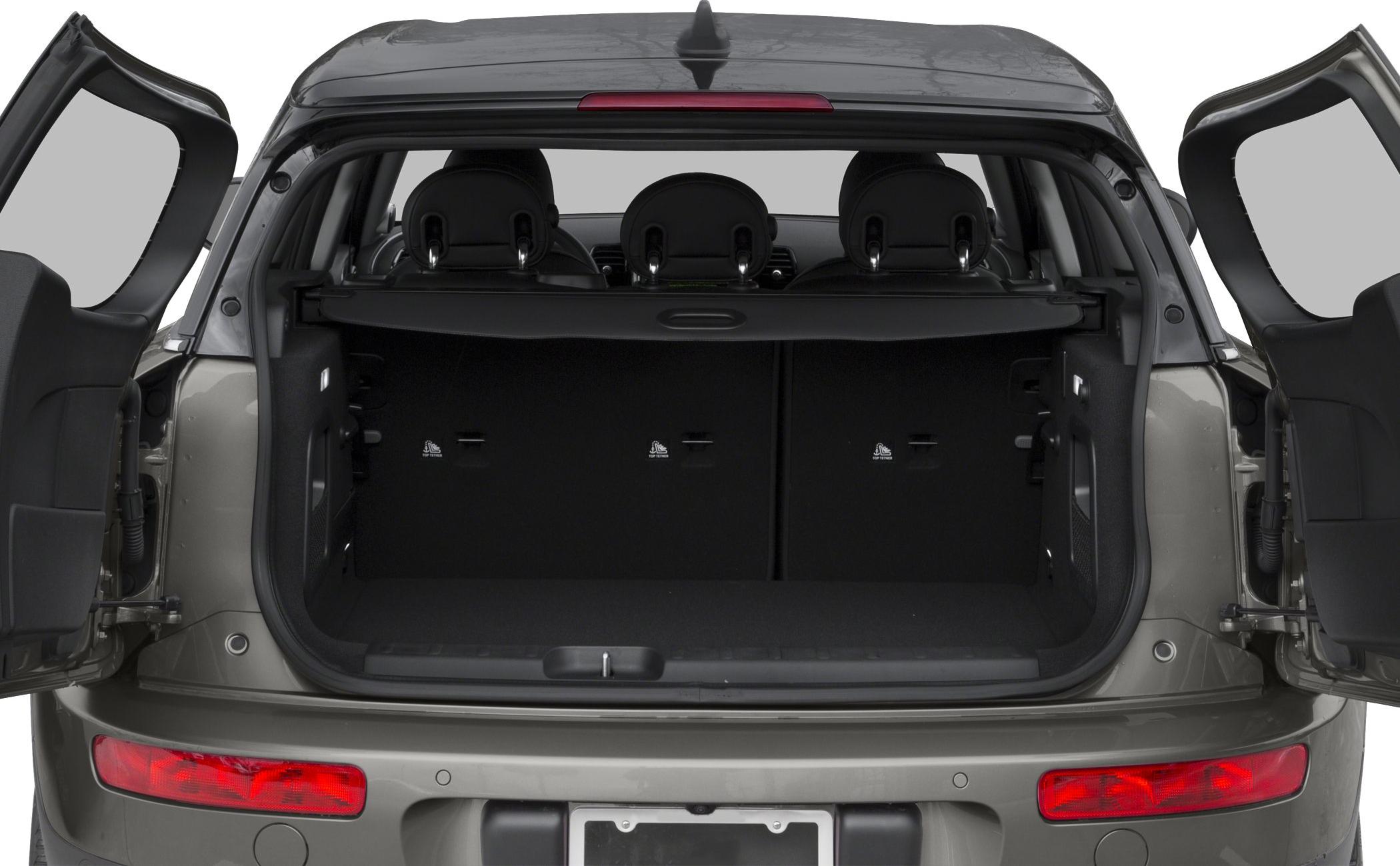 Split-opening rear doors showing spacious cargo area and rear seatbacks.