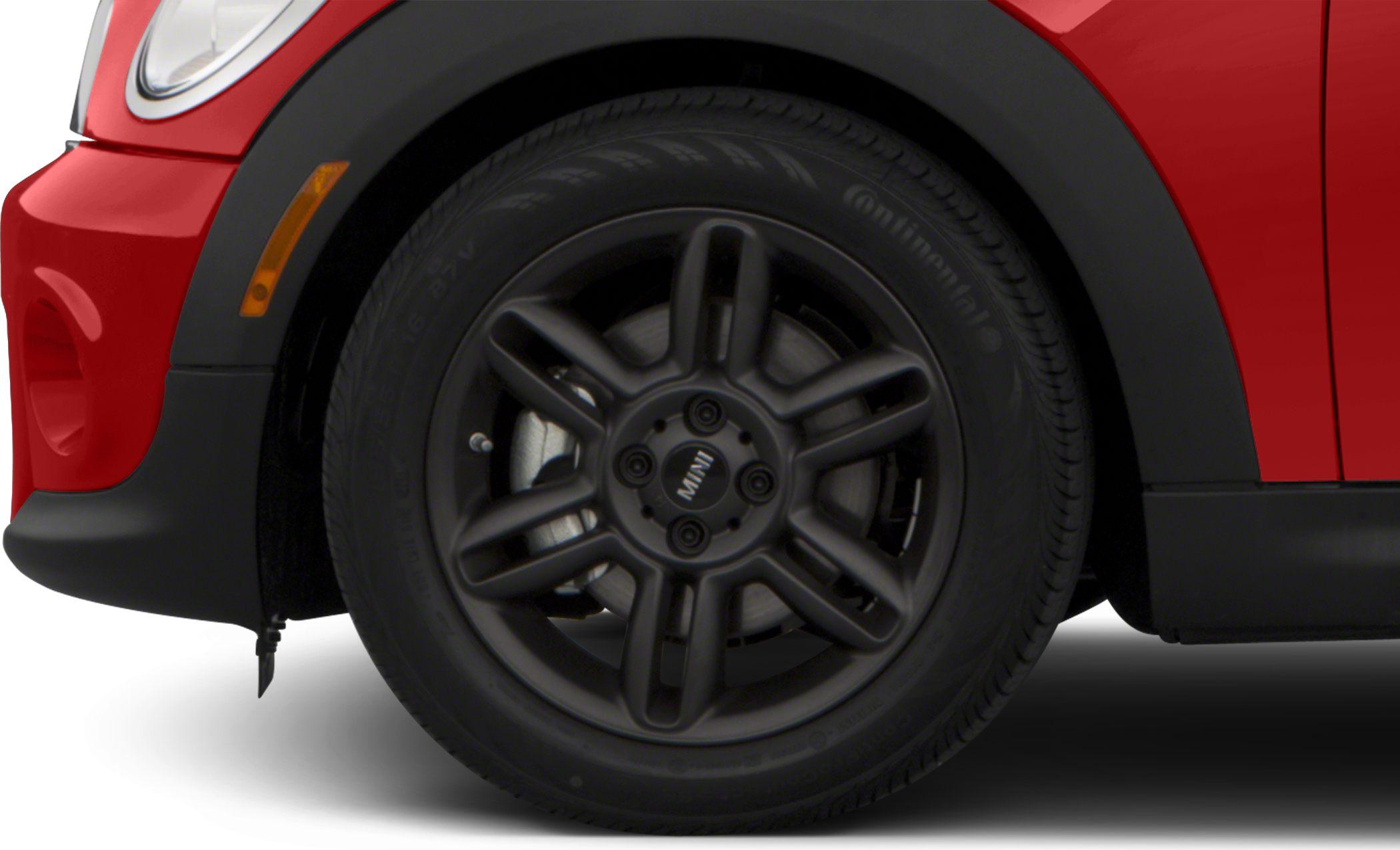 Matte black alloy wheel with tire on car front side