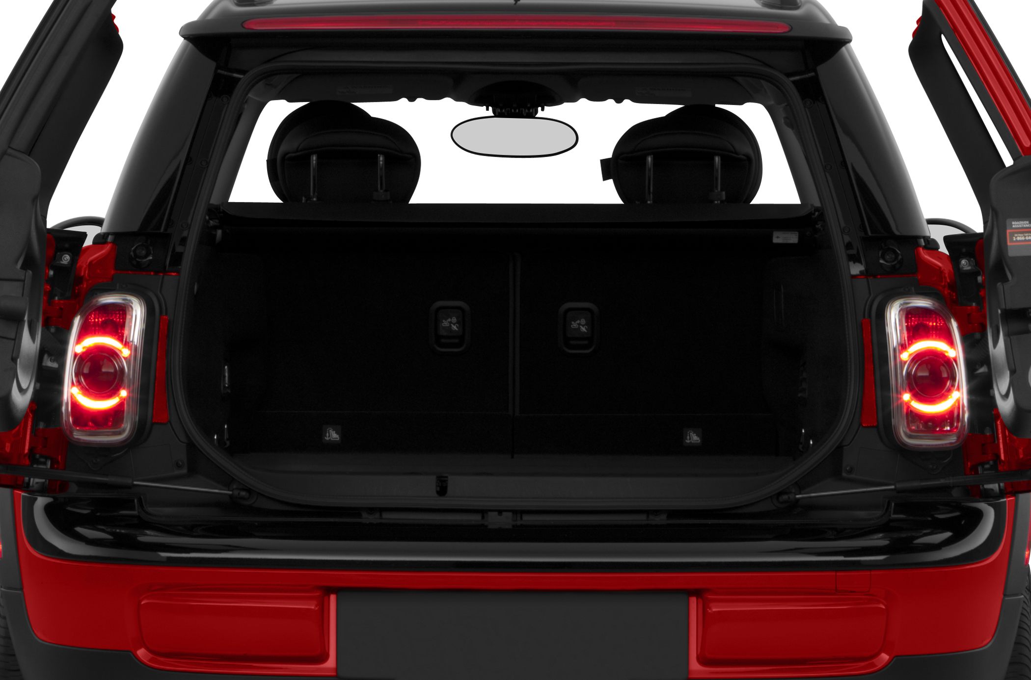 Open trunk with split rear doors and illuminated taillights