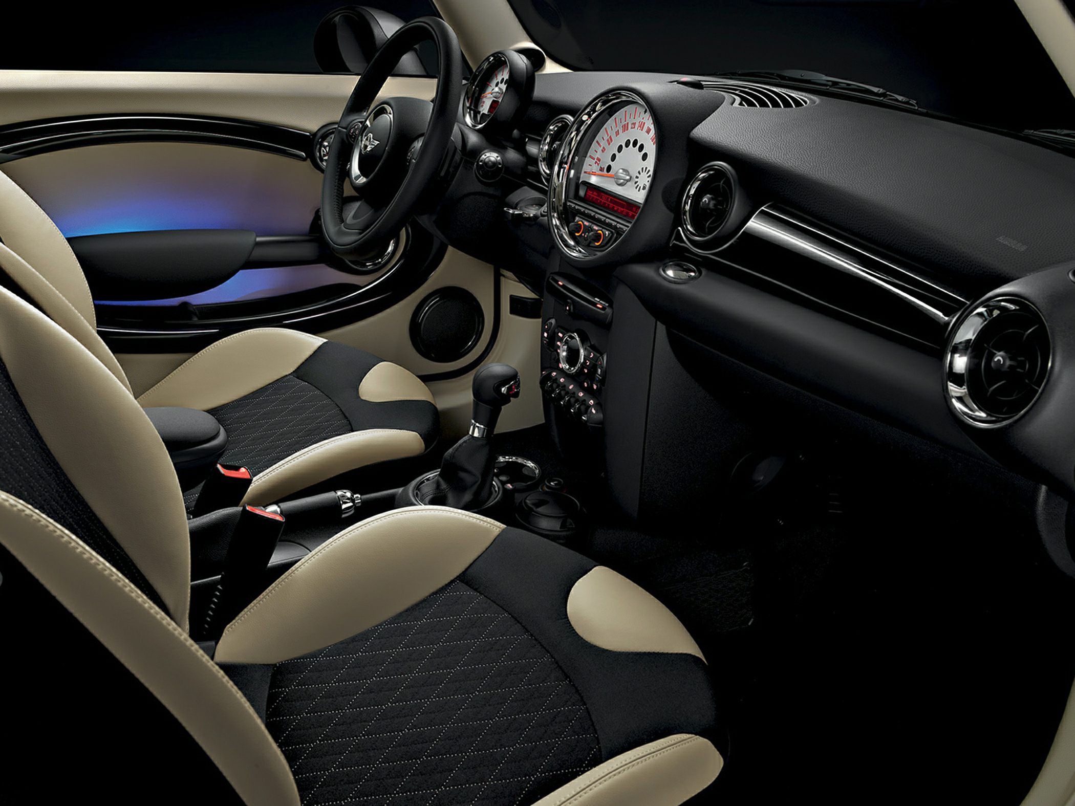Dual-tone seats and unique dashboard with large central speedometer
