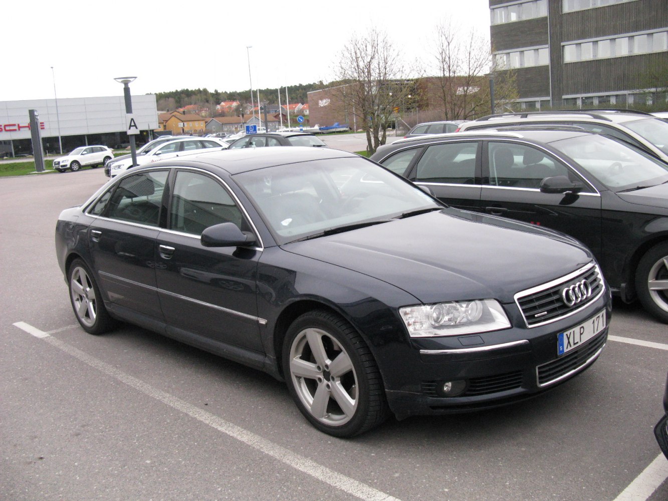 Luxury sedan front side angle with alloy wheels