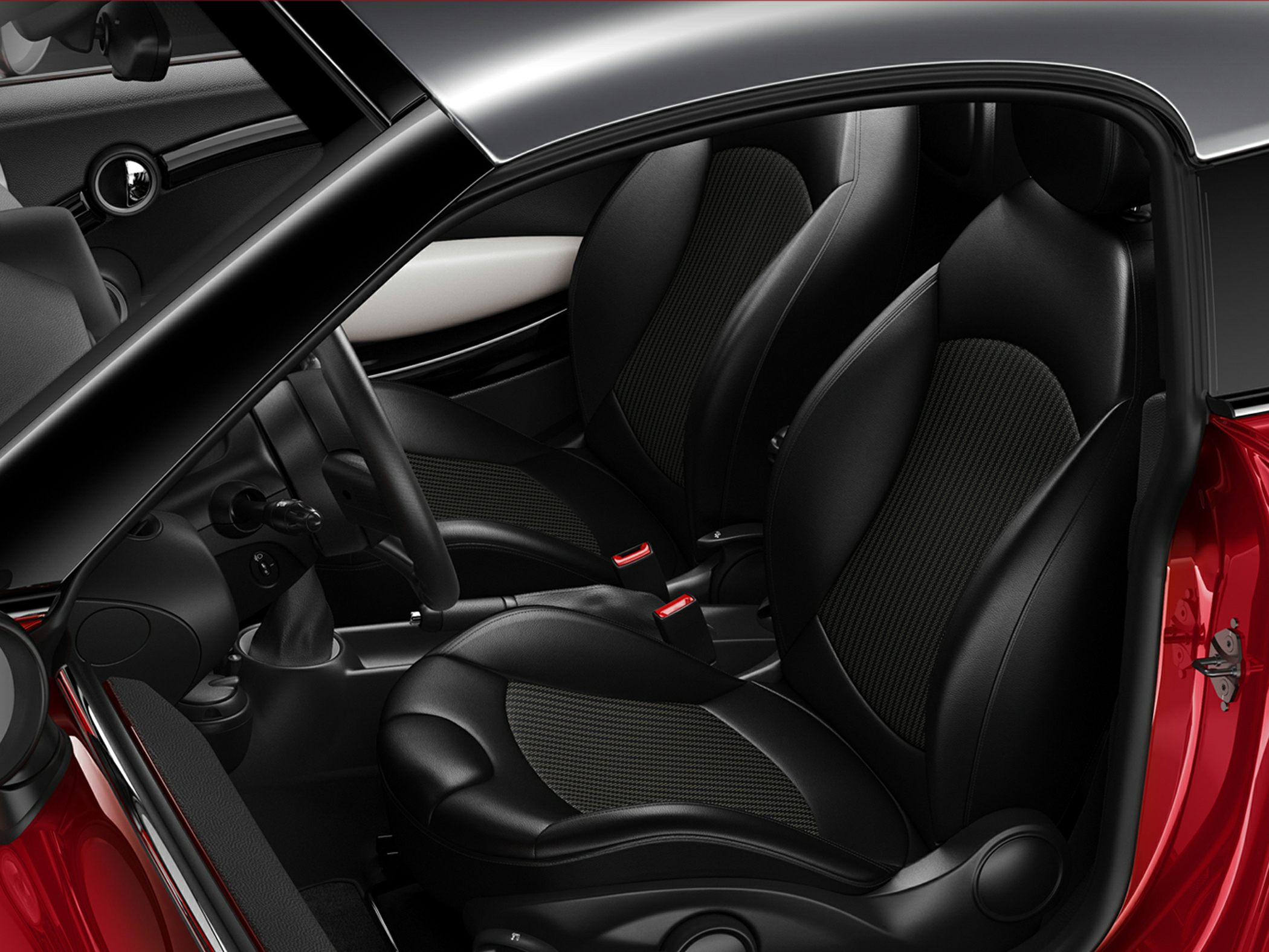 Black leather front seats and part of car interior with dashboard elements