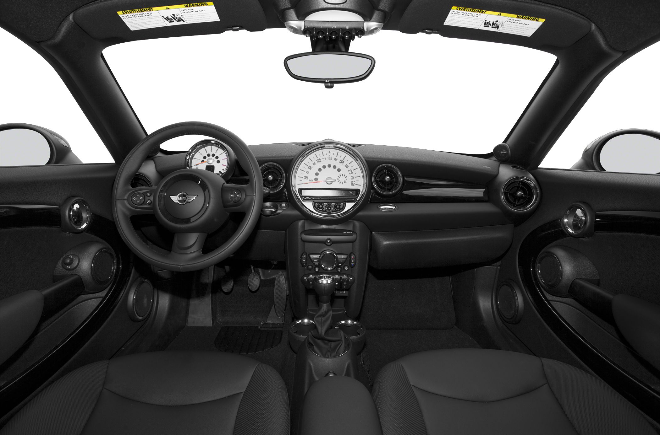 Black interior dashboard and steering wheel with central speedometer.