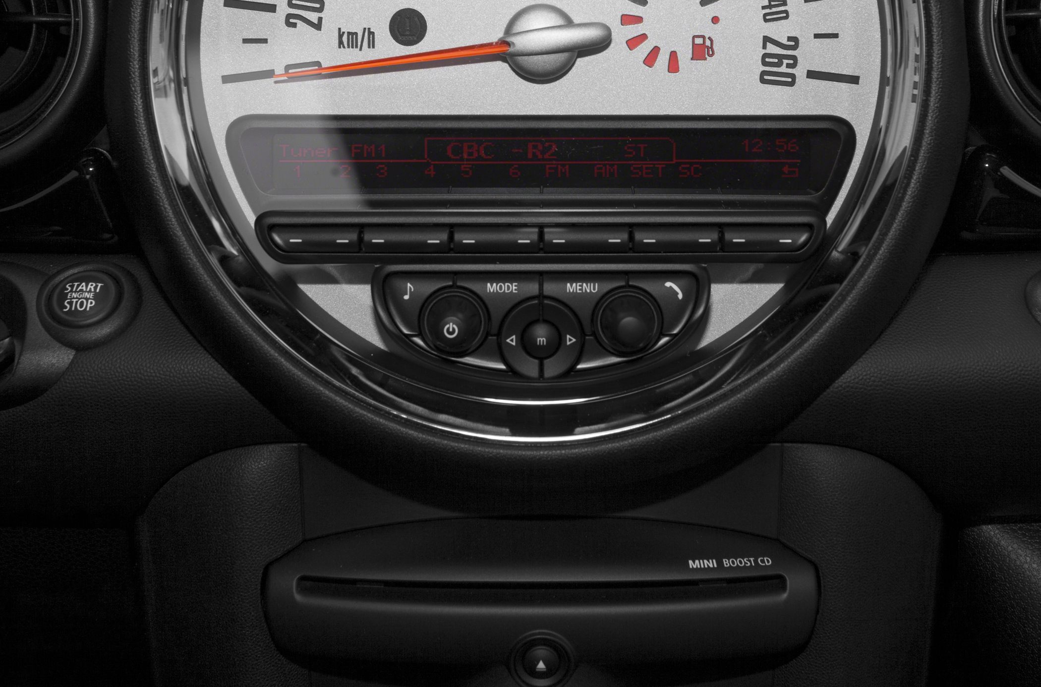 Speedometer and audio controls with start engine stop button