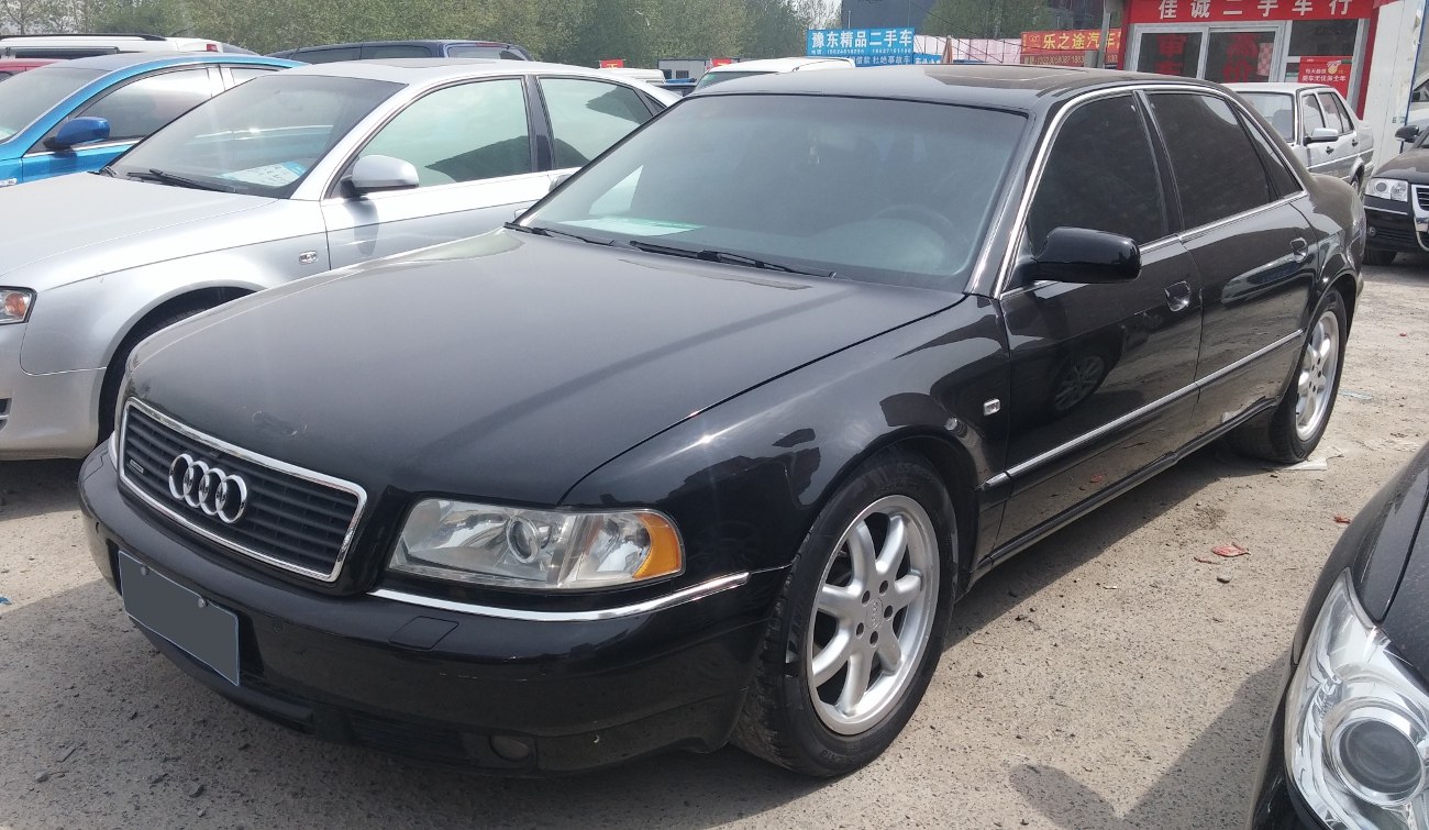 Black sedan with chrome trim and alloy wheels