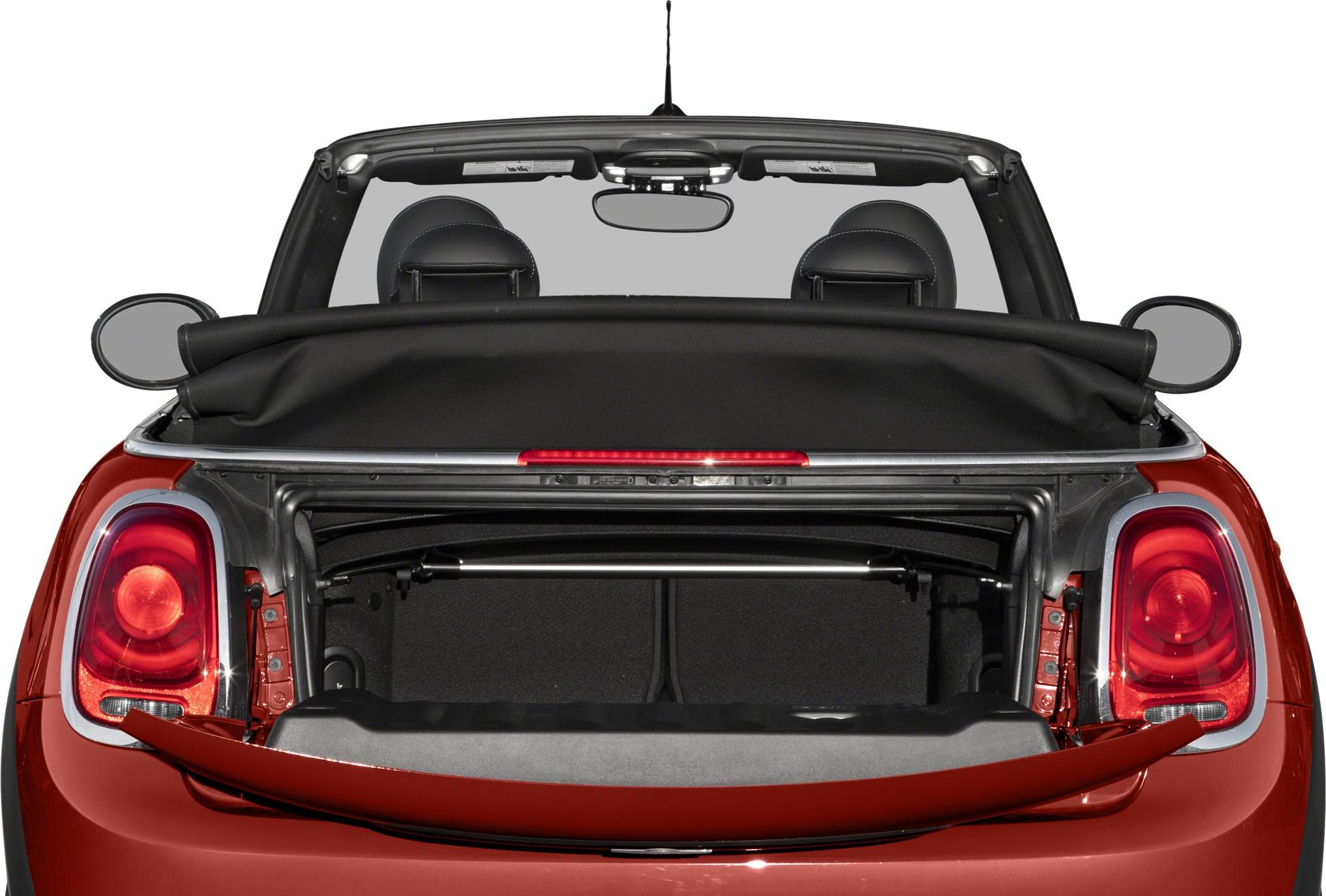 Open trunk with folded soft top roof and rear taillights.