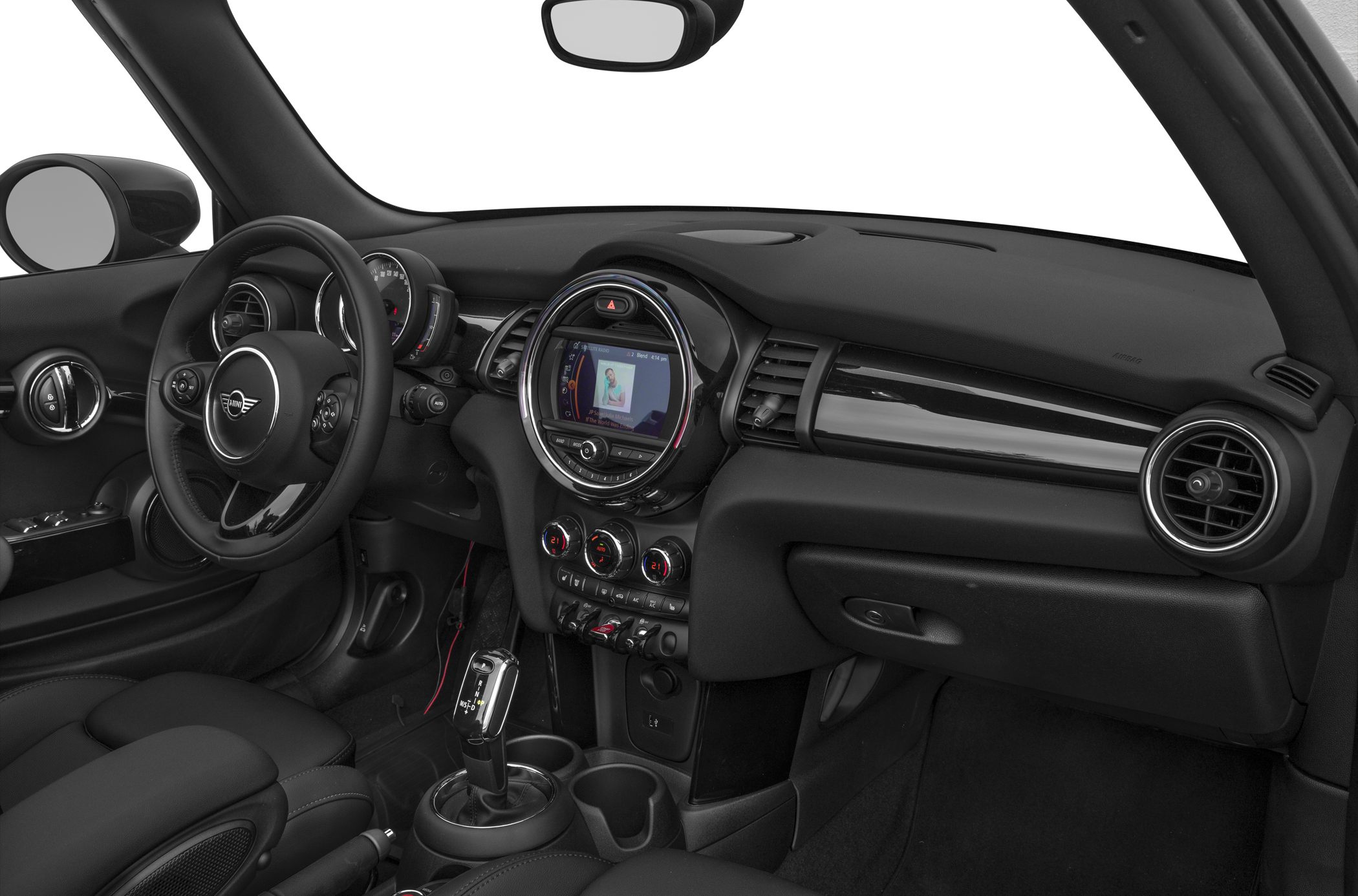 Modern car interior with round vents, digital display, and toggle switches