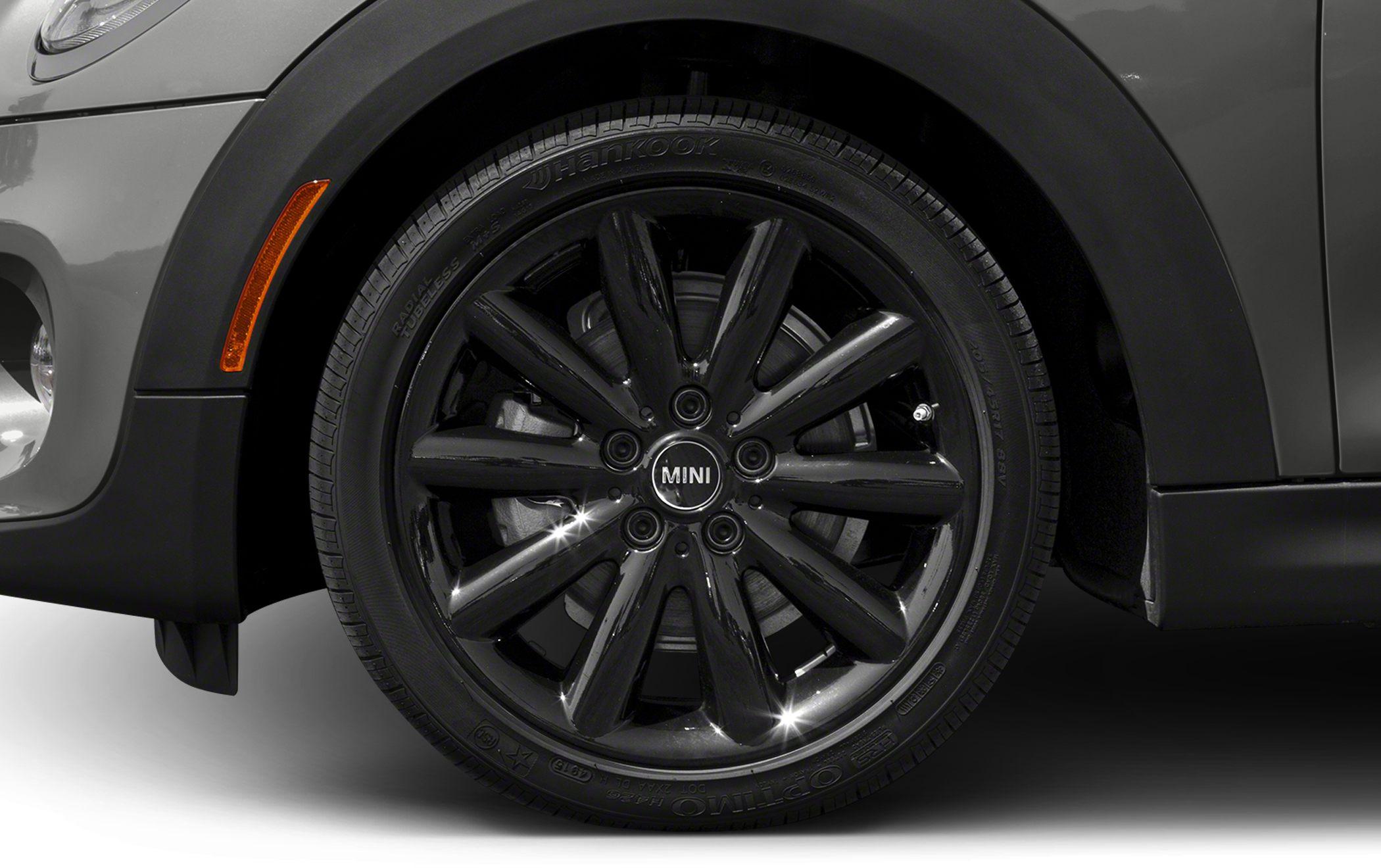 Black multi-spoke glossy alloy wheel with tire and side reflector