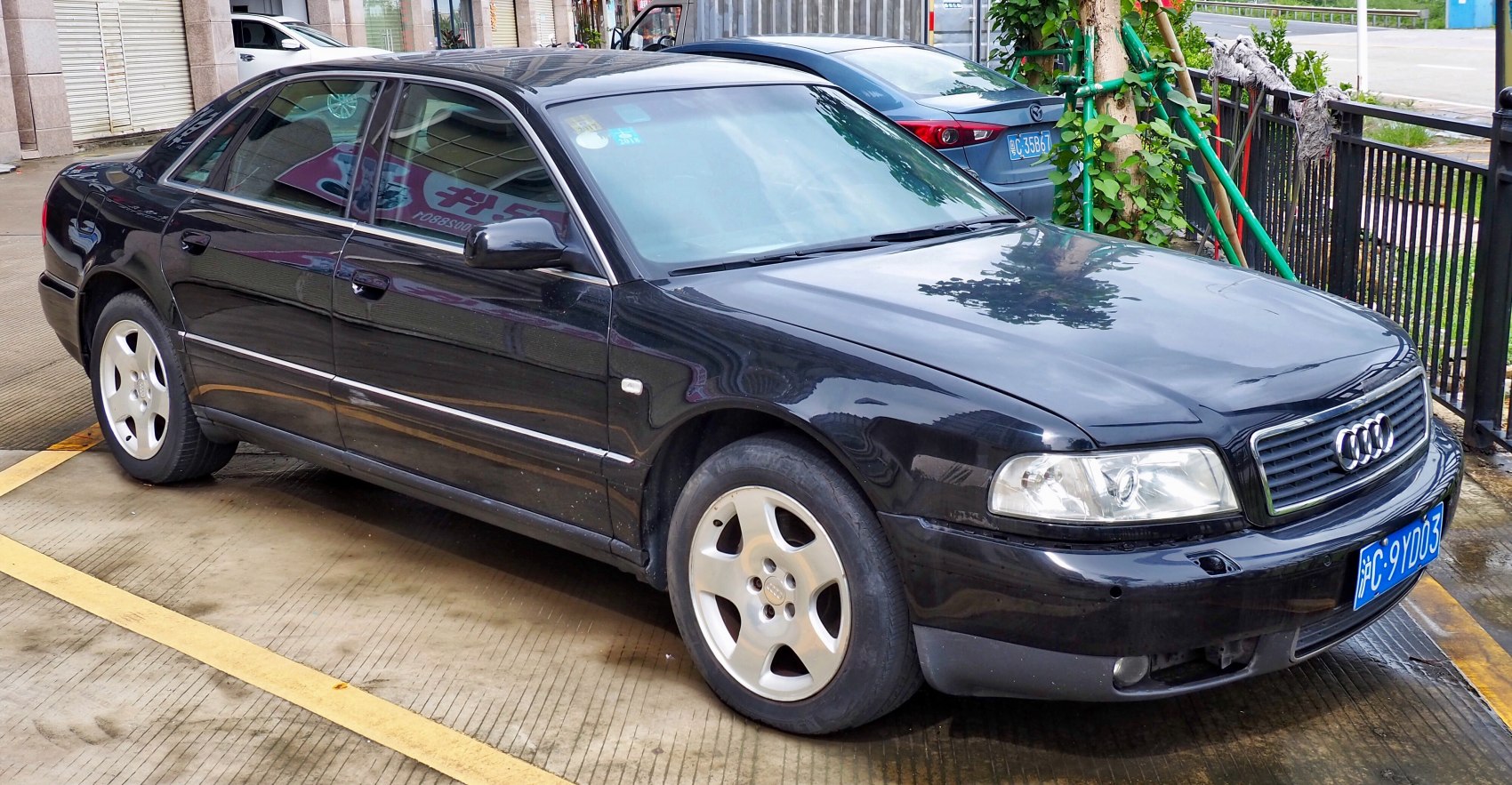 Black sedan with alloy wheels and classic grille front