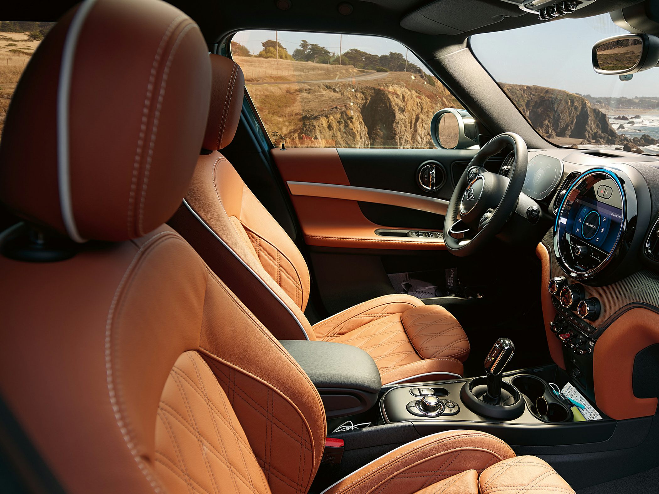 Brown leather seats with diamond stitching and modern dashboard interior