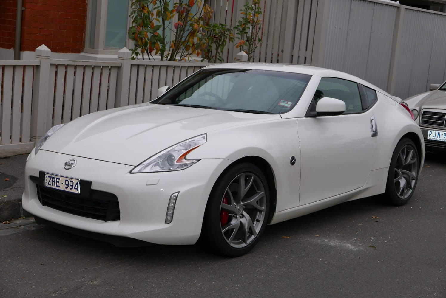 Aerodynamic front and side view with alloy wheels and sleek headlights