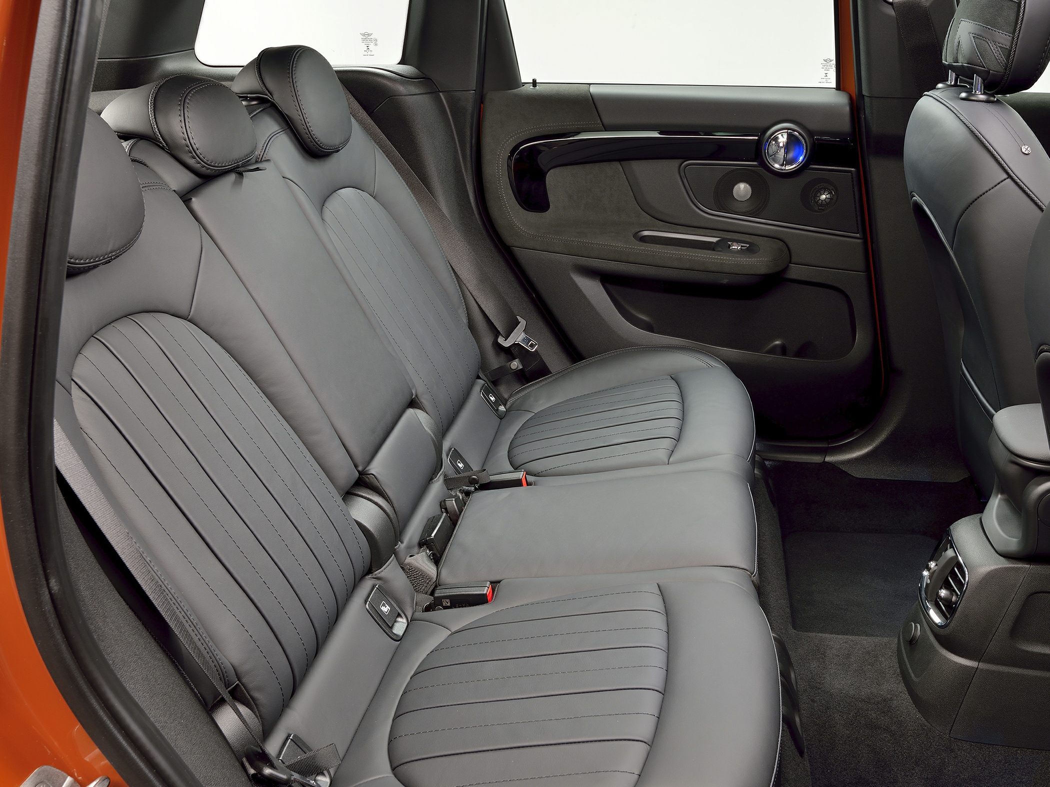 Rear leather seats and door panel with speaker and armrest