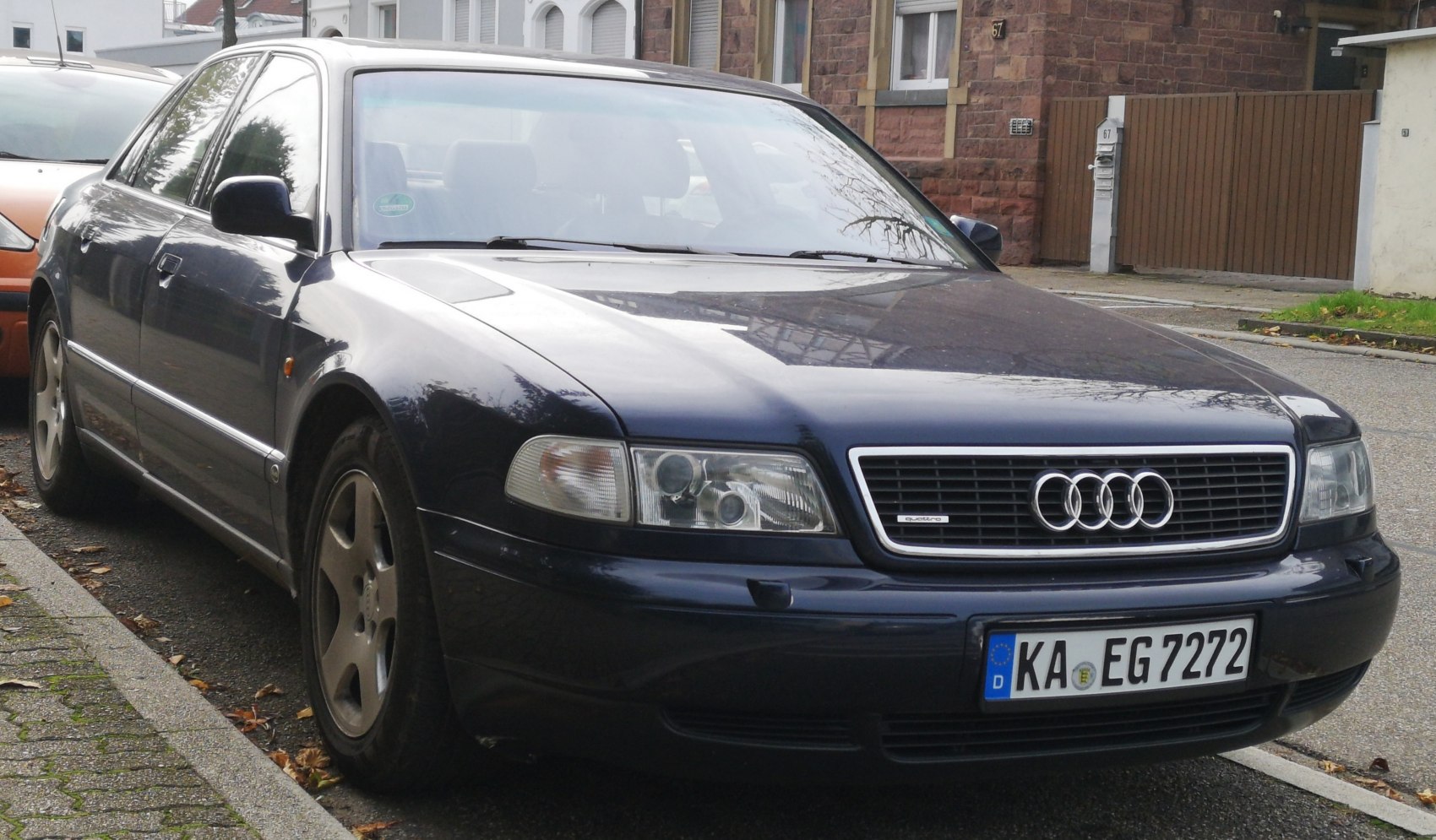 Classic 1990s luxury sedan with rectangular headlights and signature grille.