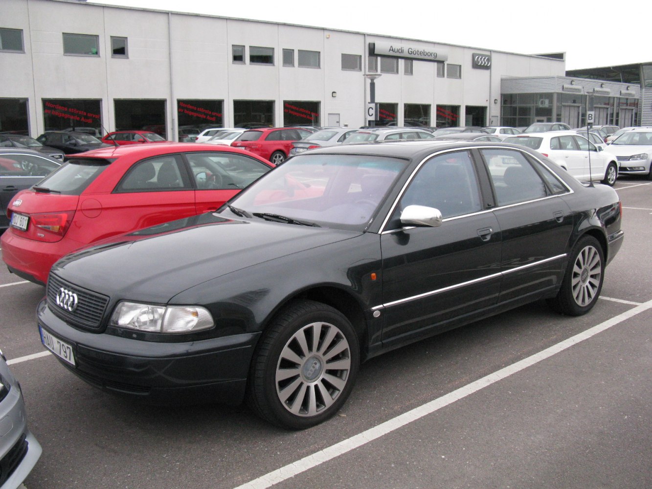 Black luxury sedan with distinctive alloy wheels and sleek styling