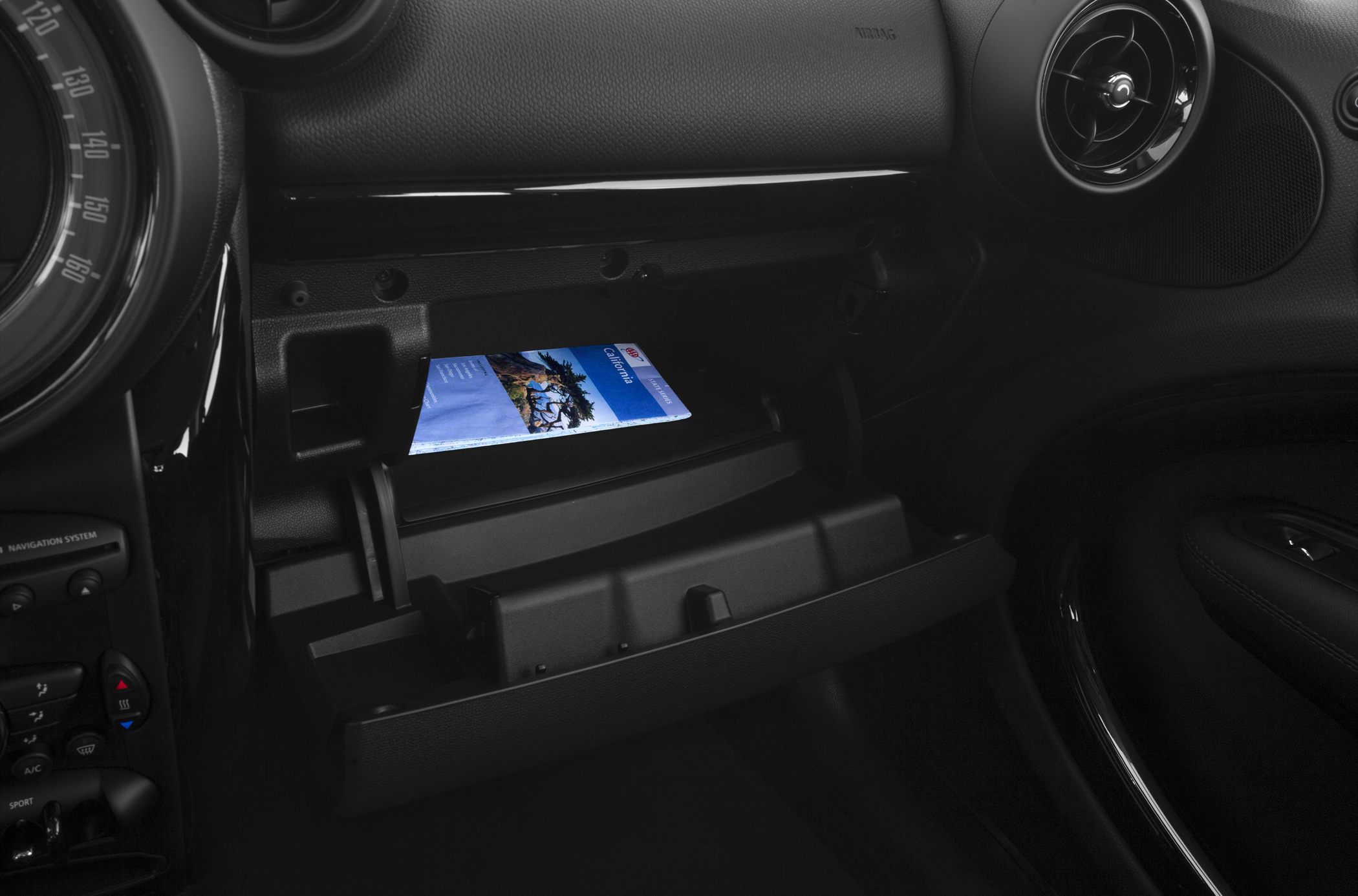 Open glove compartment with storage space and interior details